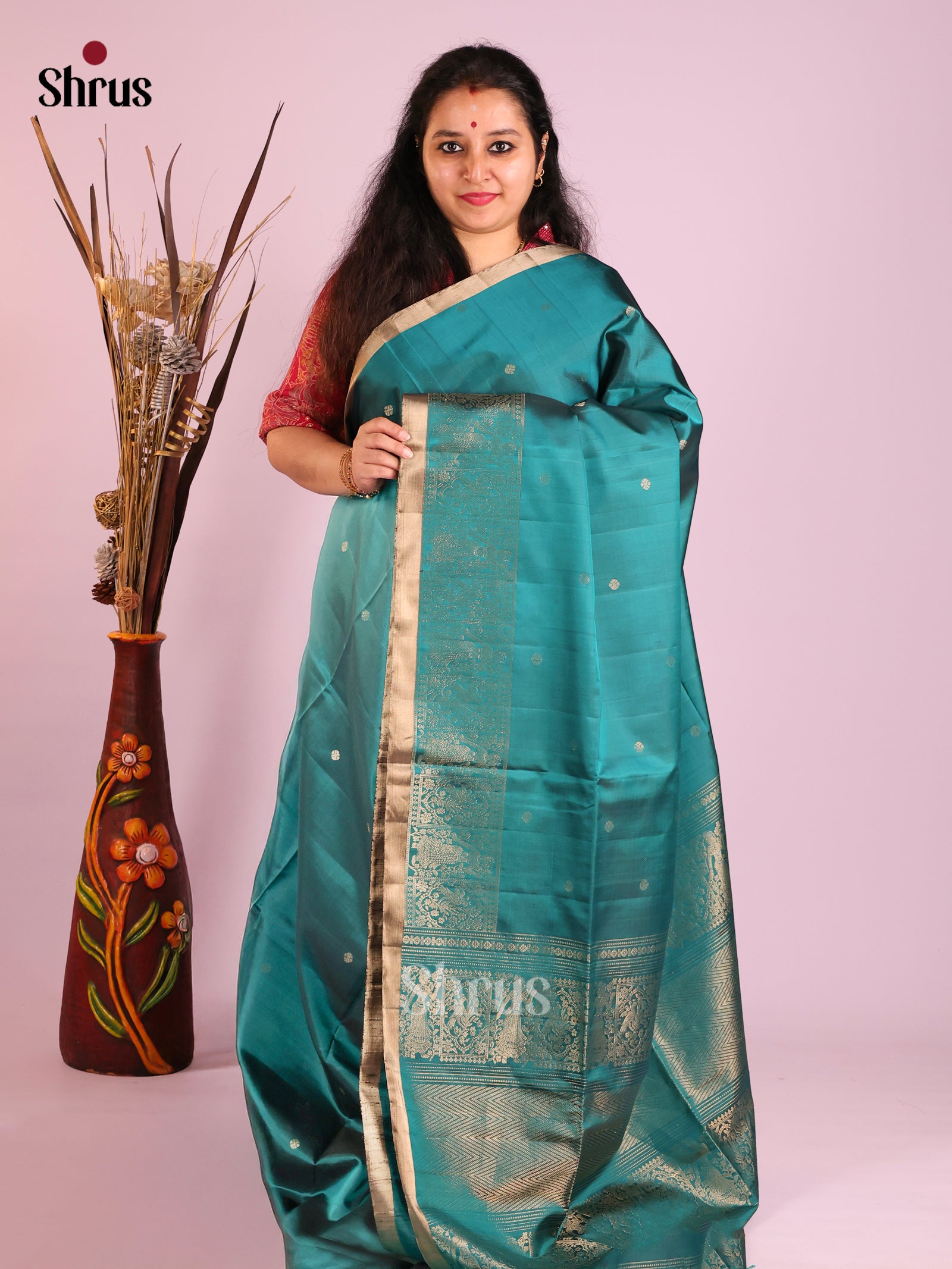 Elegant Blue Soft Silk Saree with Gold buttas & Zari Woven Doll Themed Border