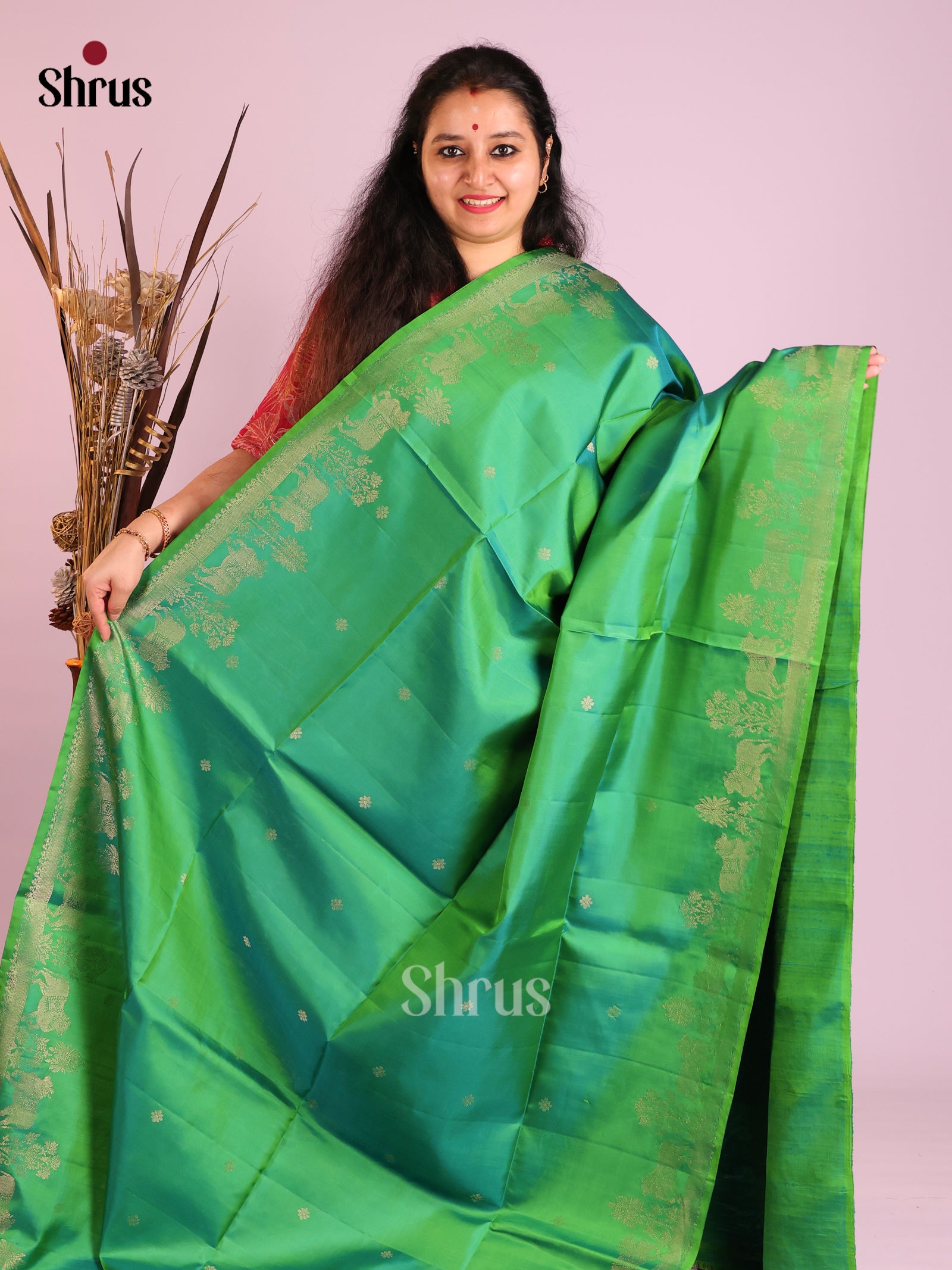 Festive Green Soft Silk Saree with gold Buttas & Zari Woven cow motifs in border 1