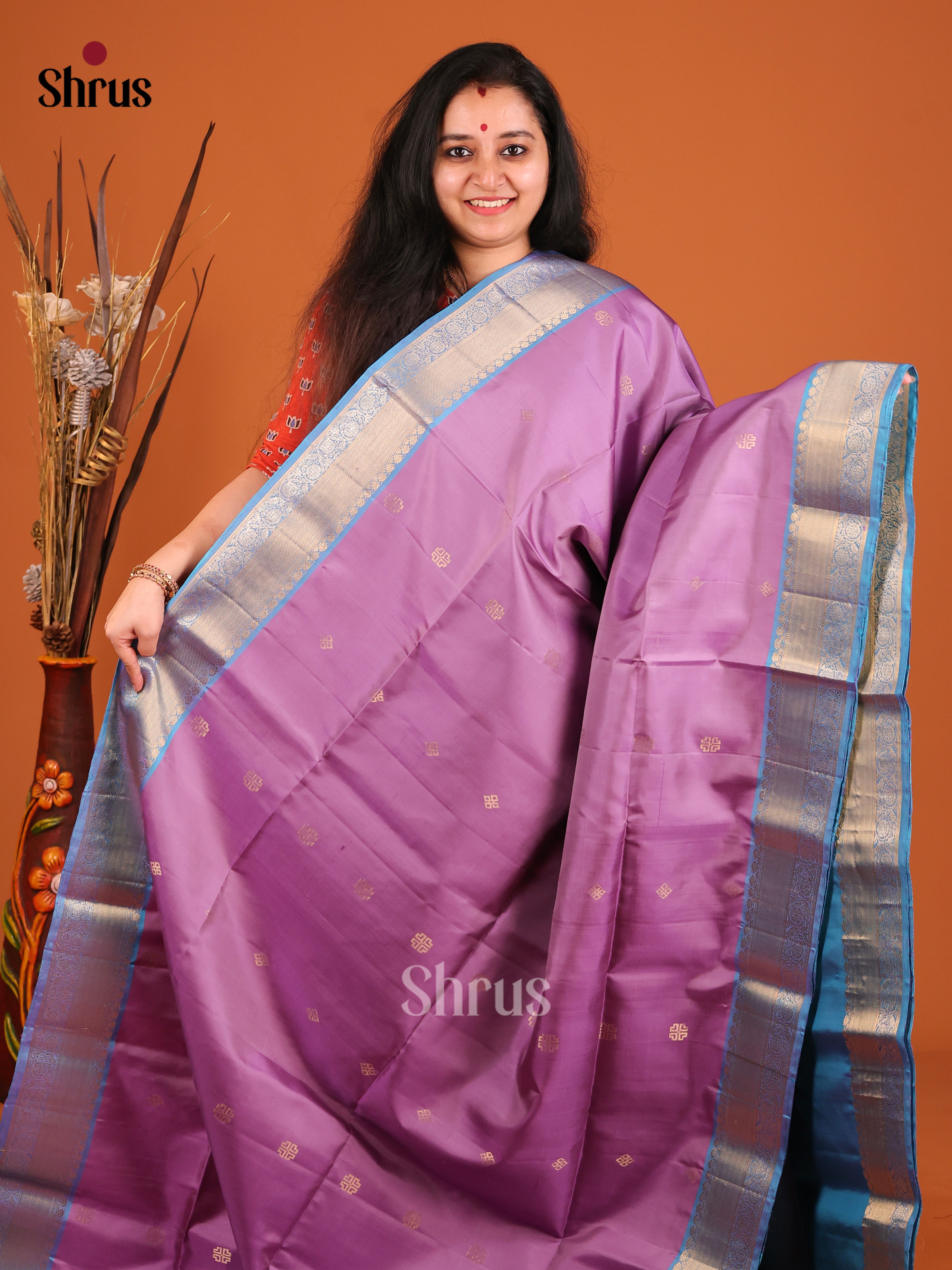 Beautifully chic Lavender Soft Silk Saree with splendid zari border