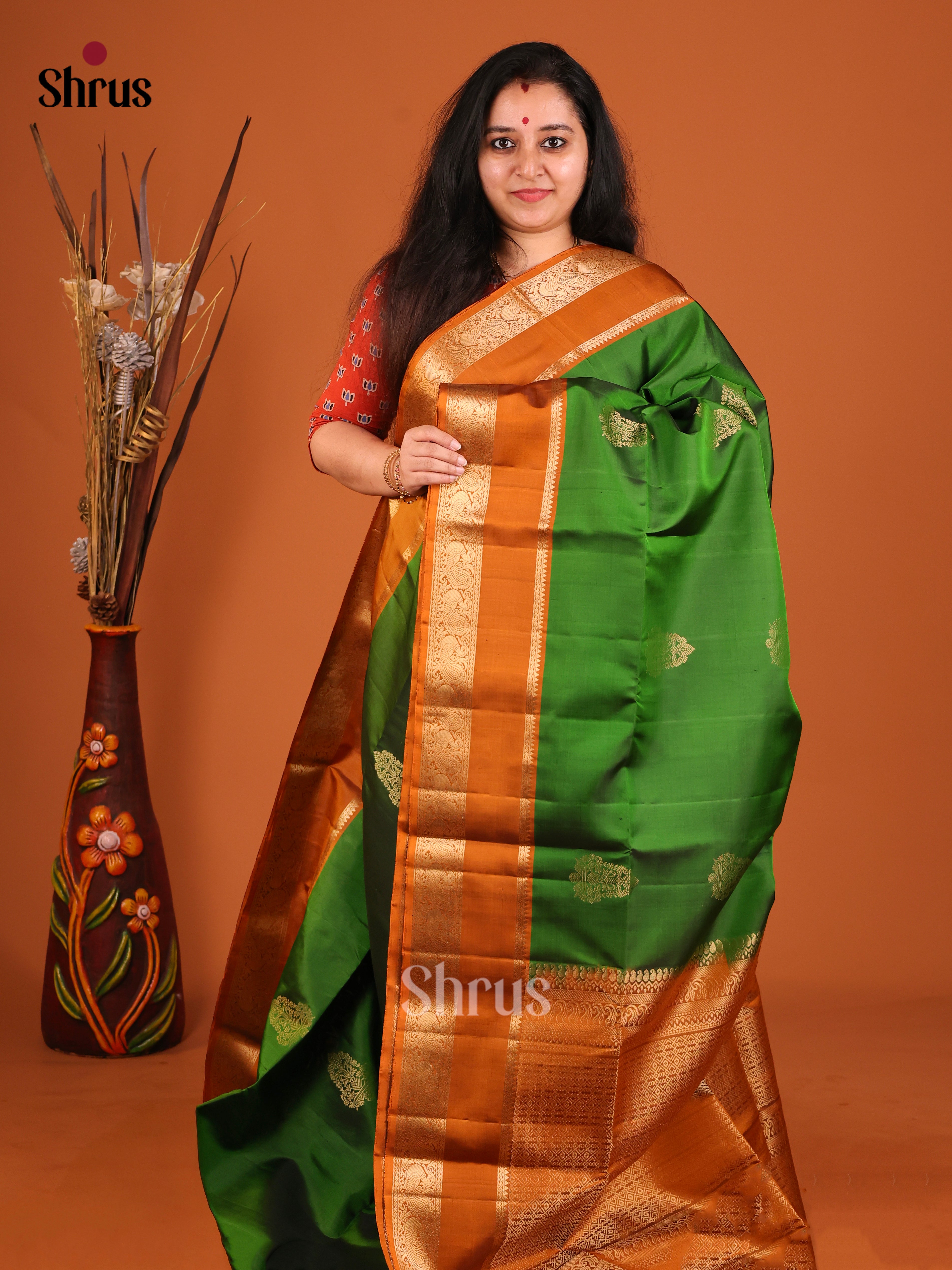 Luminous Green Soft Silk Saree with gold floral Motifs & Brick Zari Woven Border 