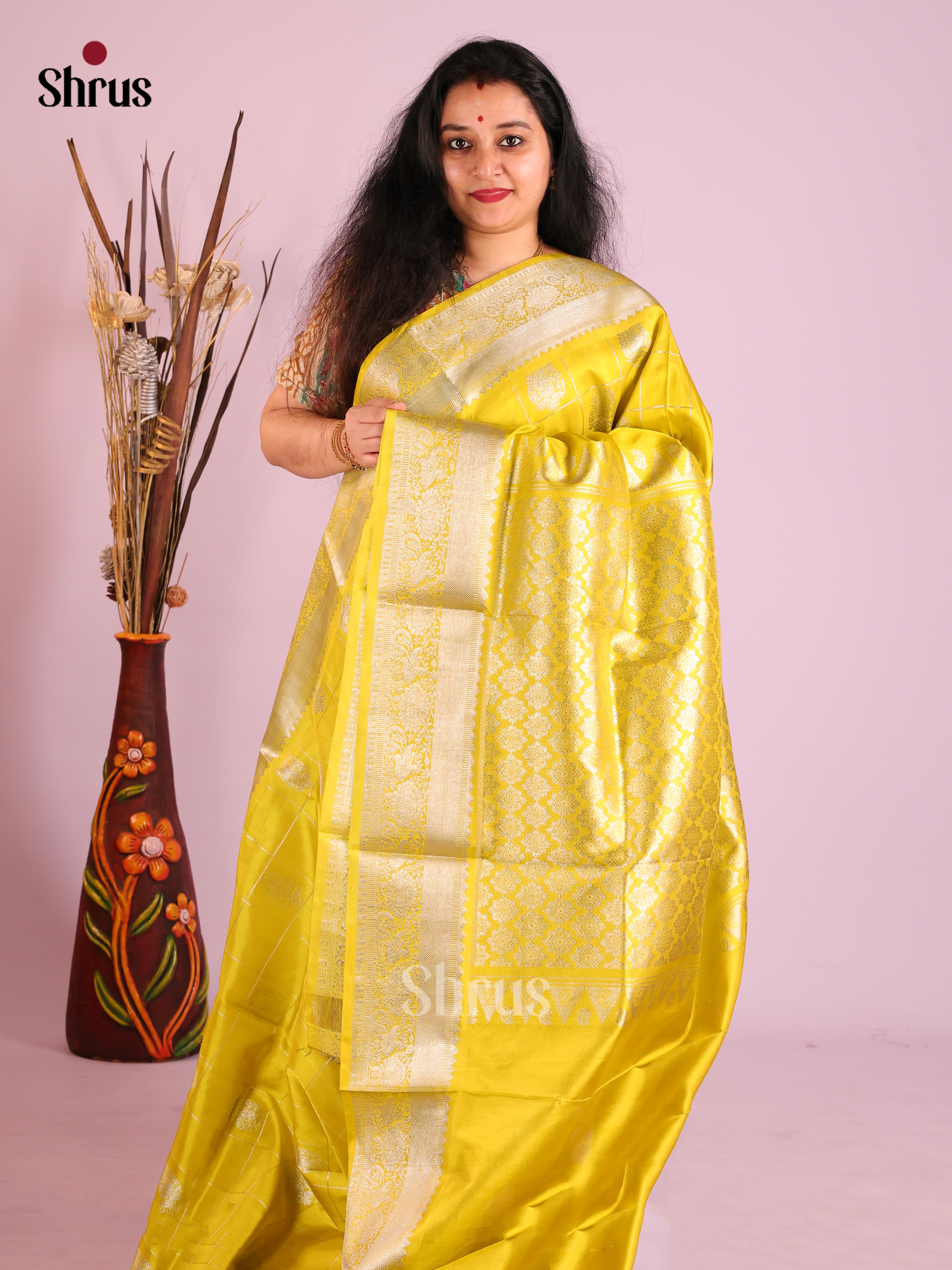 Yellow single Tone  Venkatagiri silk Saree gleams with zari checks & floral motifs