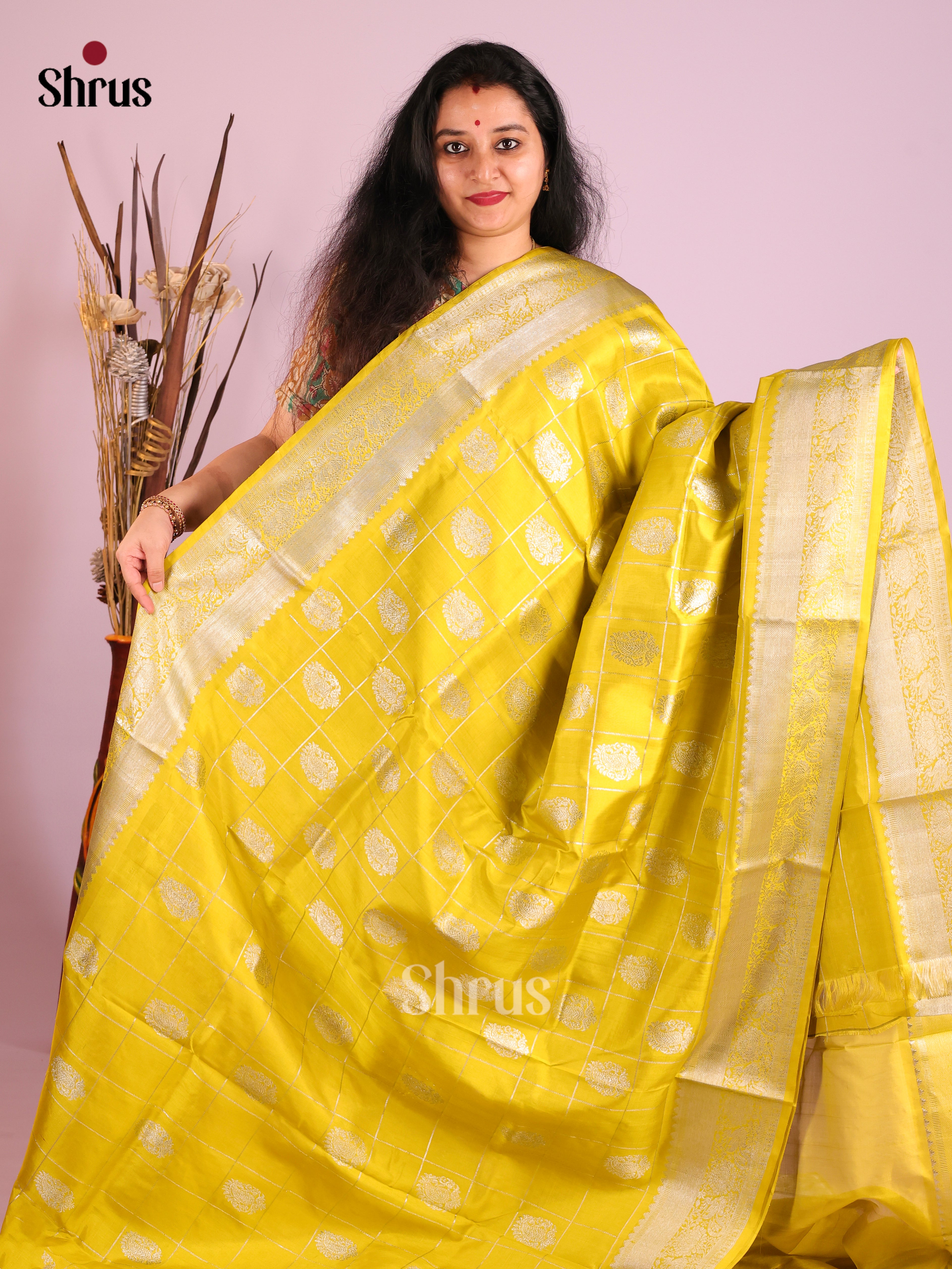 Yellow single Tone  Venkatagiri silk Saree gleams with zari checks & floral motifs