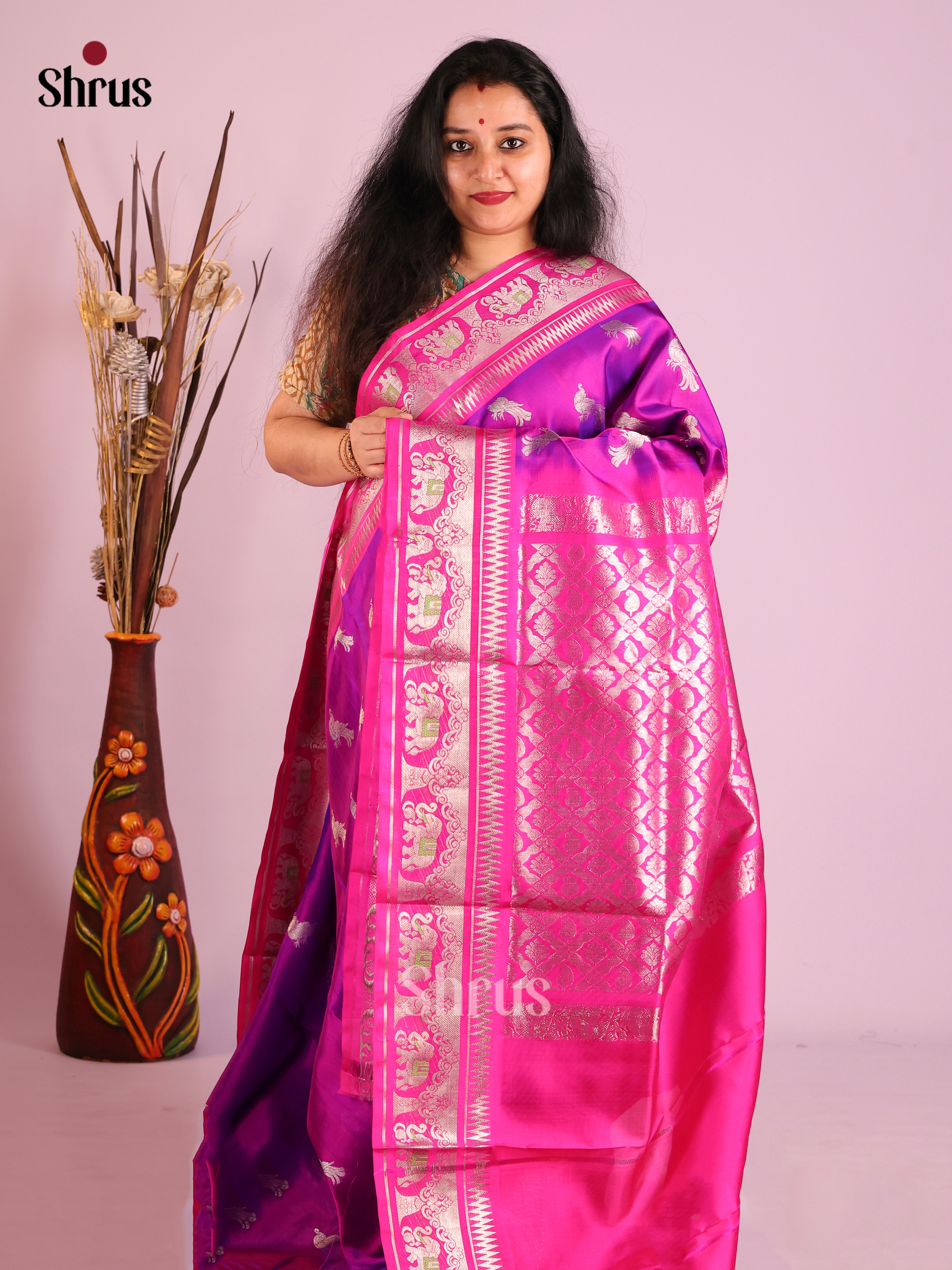 Purple & Pink Venkatagiri silk Saree adorned with zari peacock buttas