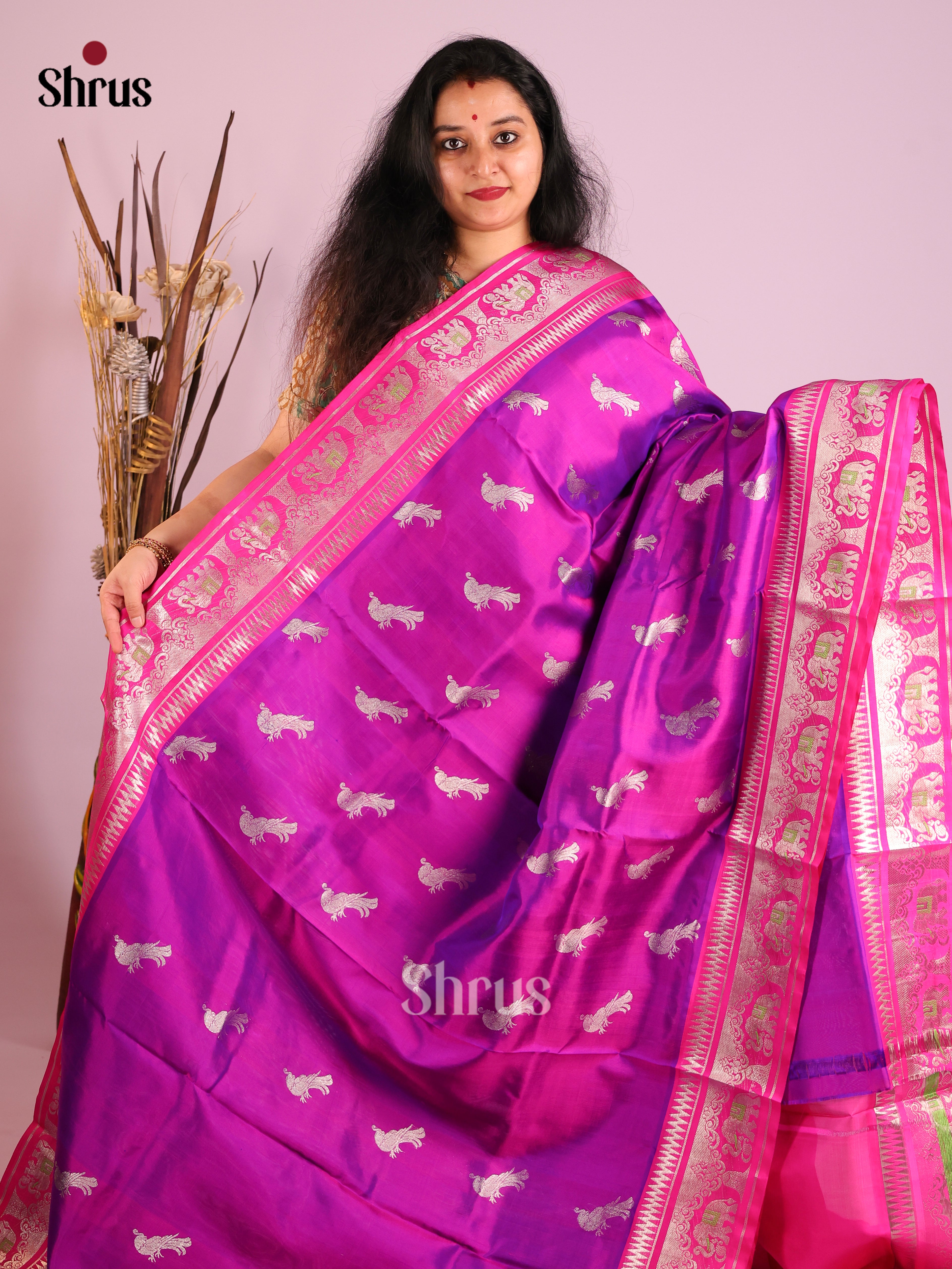 Purple & Pink Venkatagiri silk Saree adorned with zari peacock buttas