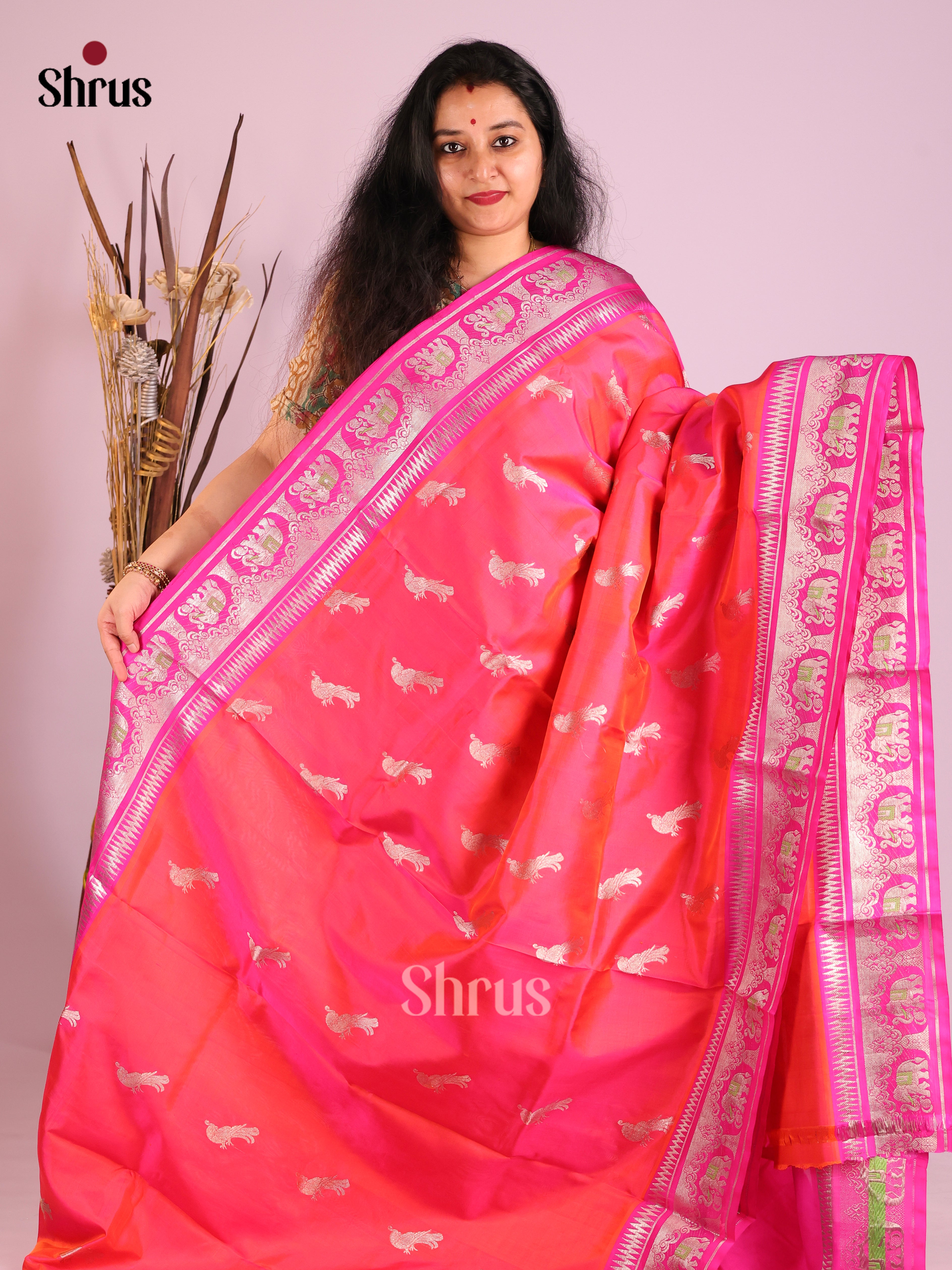Orangish Pink  & Pink Venkatagiri silk Saree gleams with zari peacock buttas