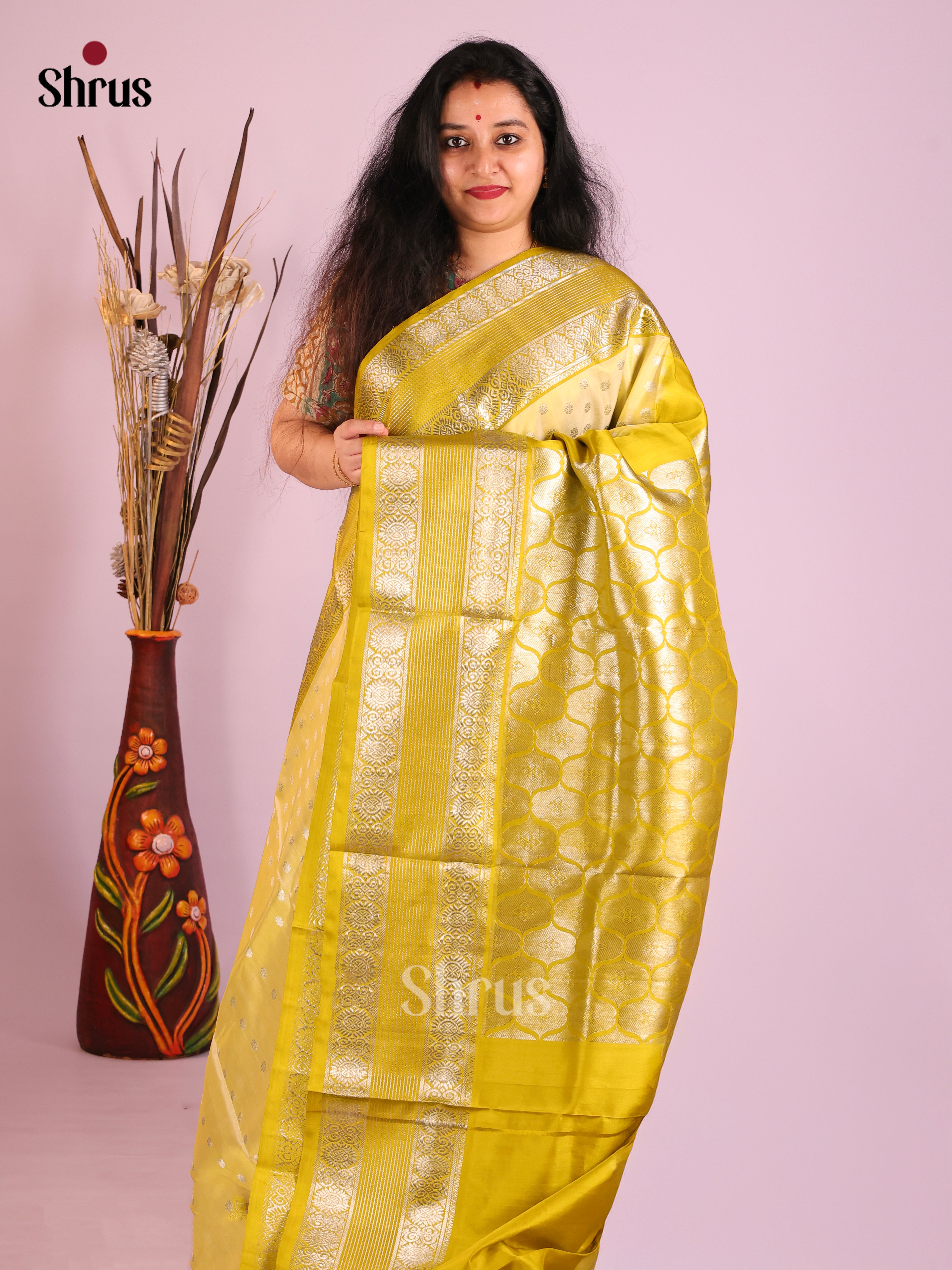 Light Yellow single Tone Venkatagiri silk Saree gleams with zari buttas , rettaipet border