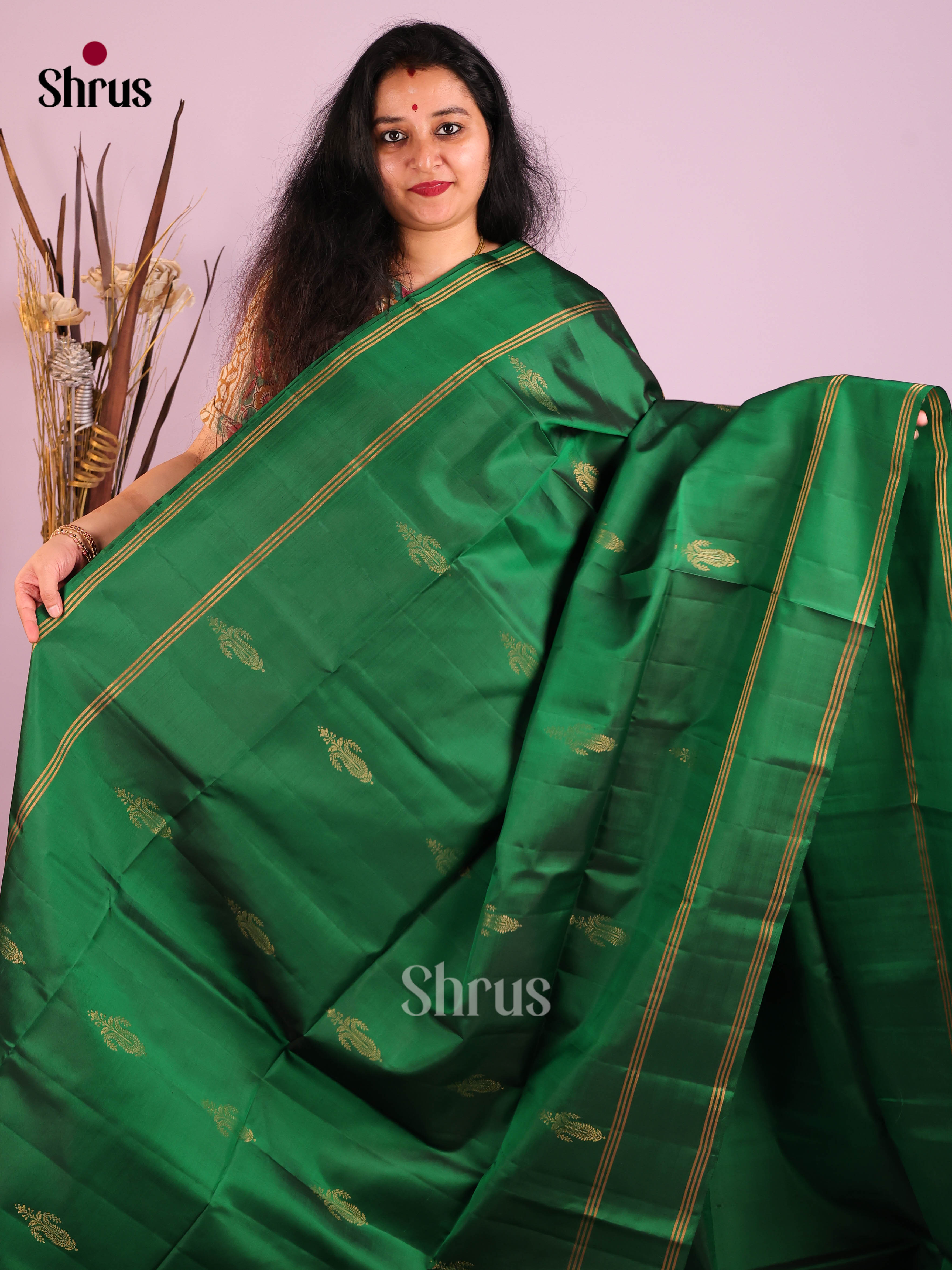 Classy Green Soft Silk Saree with gold floral motifs & Rettaipet Zari Border 1