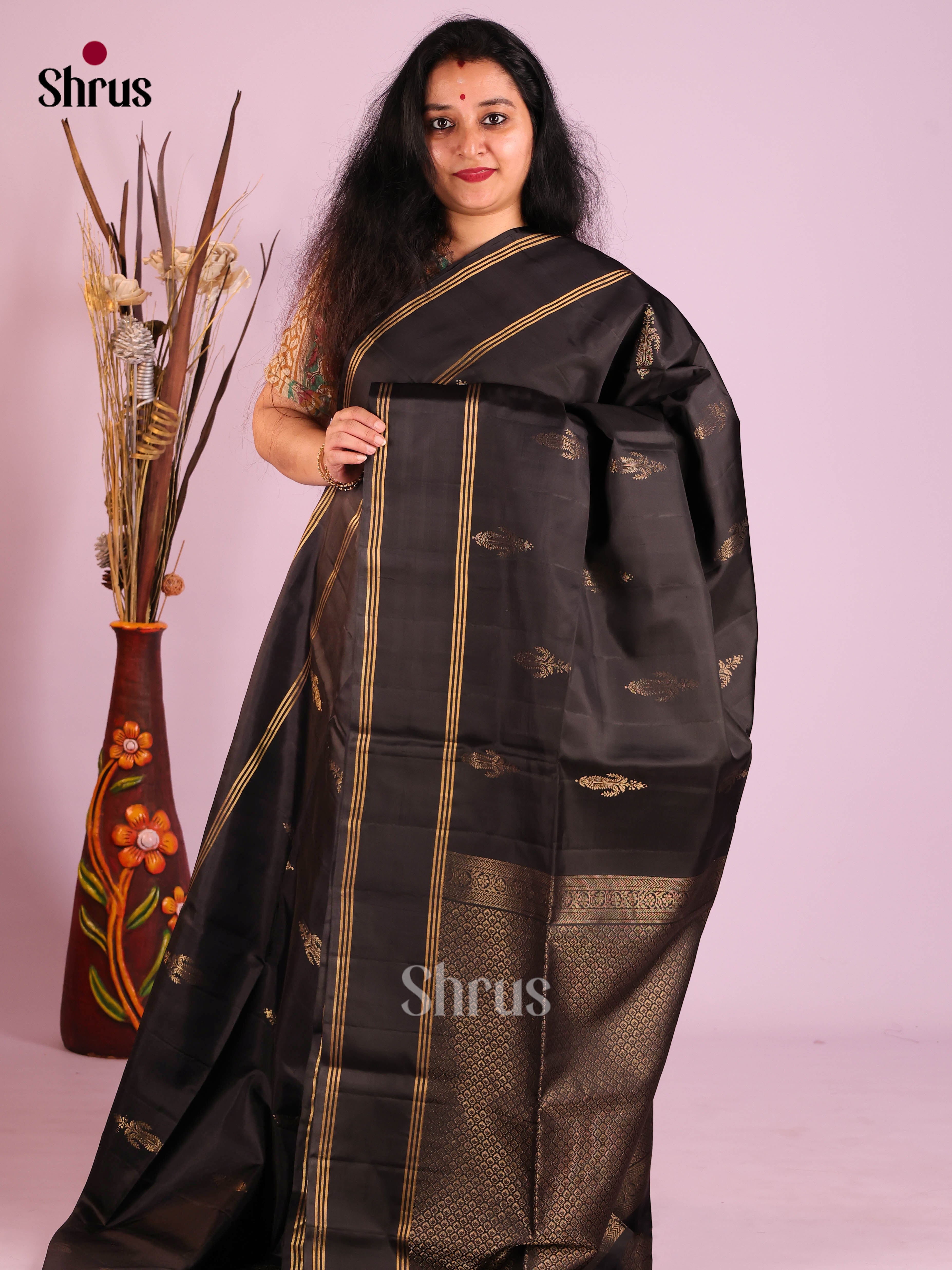 Mystique Black Soft Silk Saree with gold floral motifs & Rettaipet Zari Border