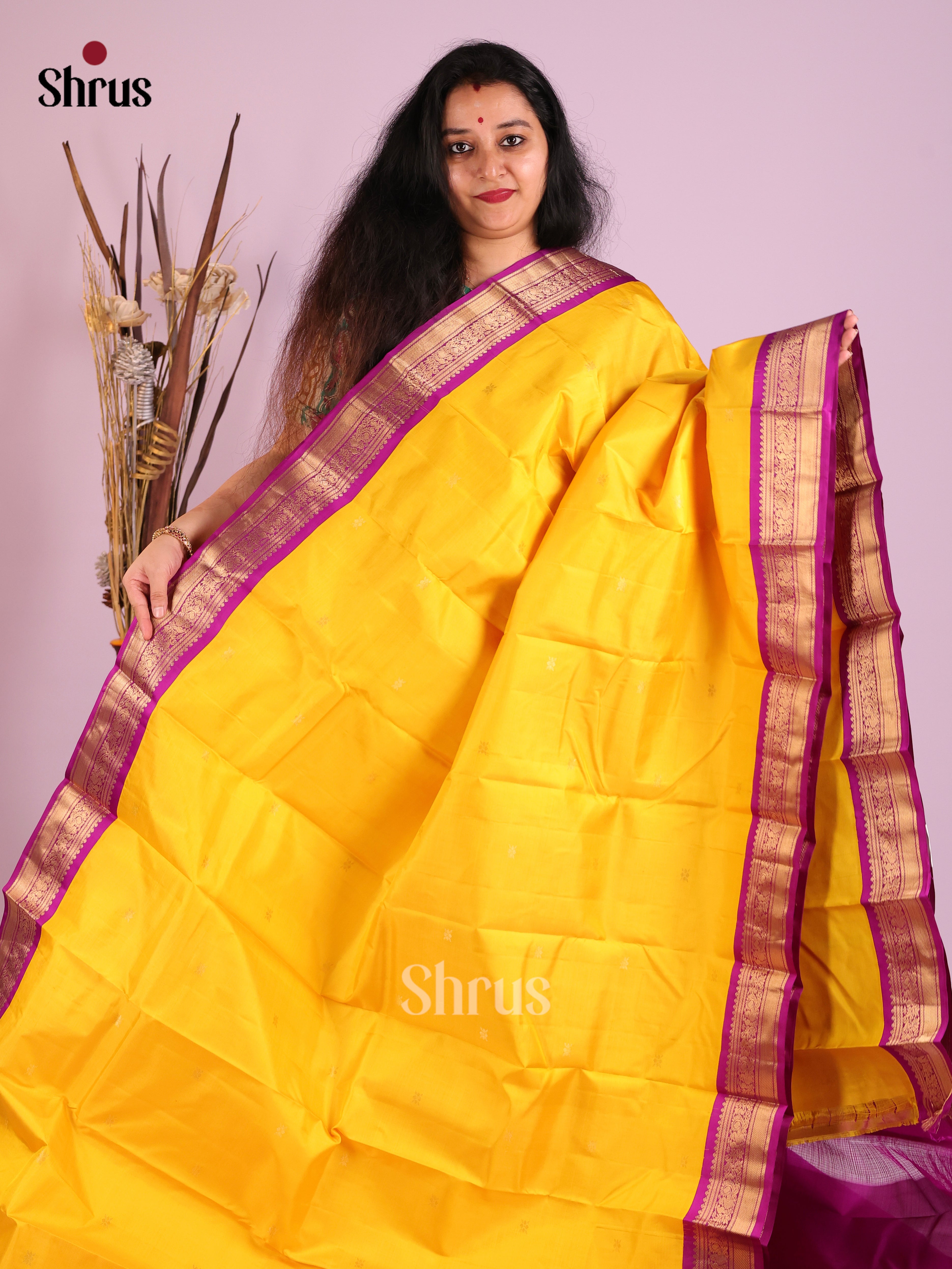 Luminous Yellow Kanjivaram Saree with golden buttas & Purple Brocade Pallu 1