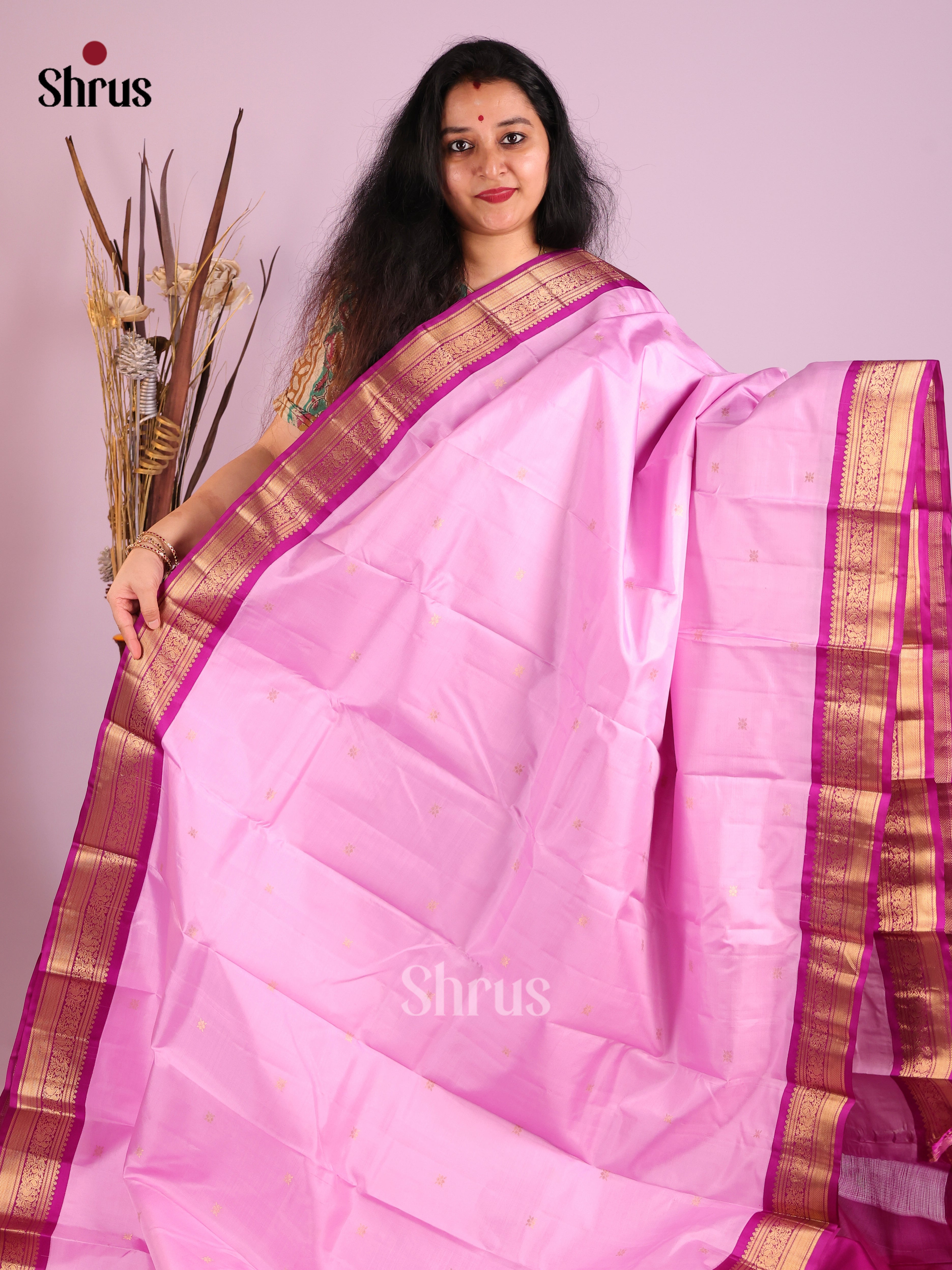 Gorgeous Baby Pink Kanjivaram Saree with Golden buttas & Purple zari border