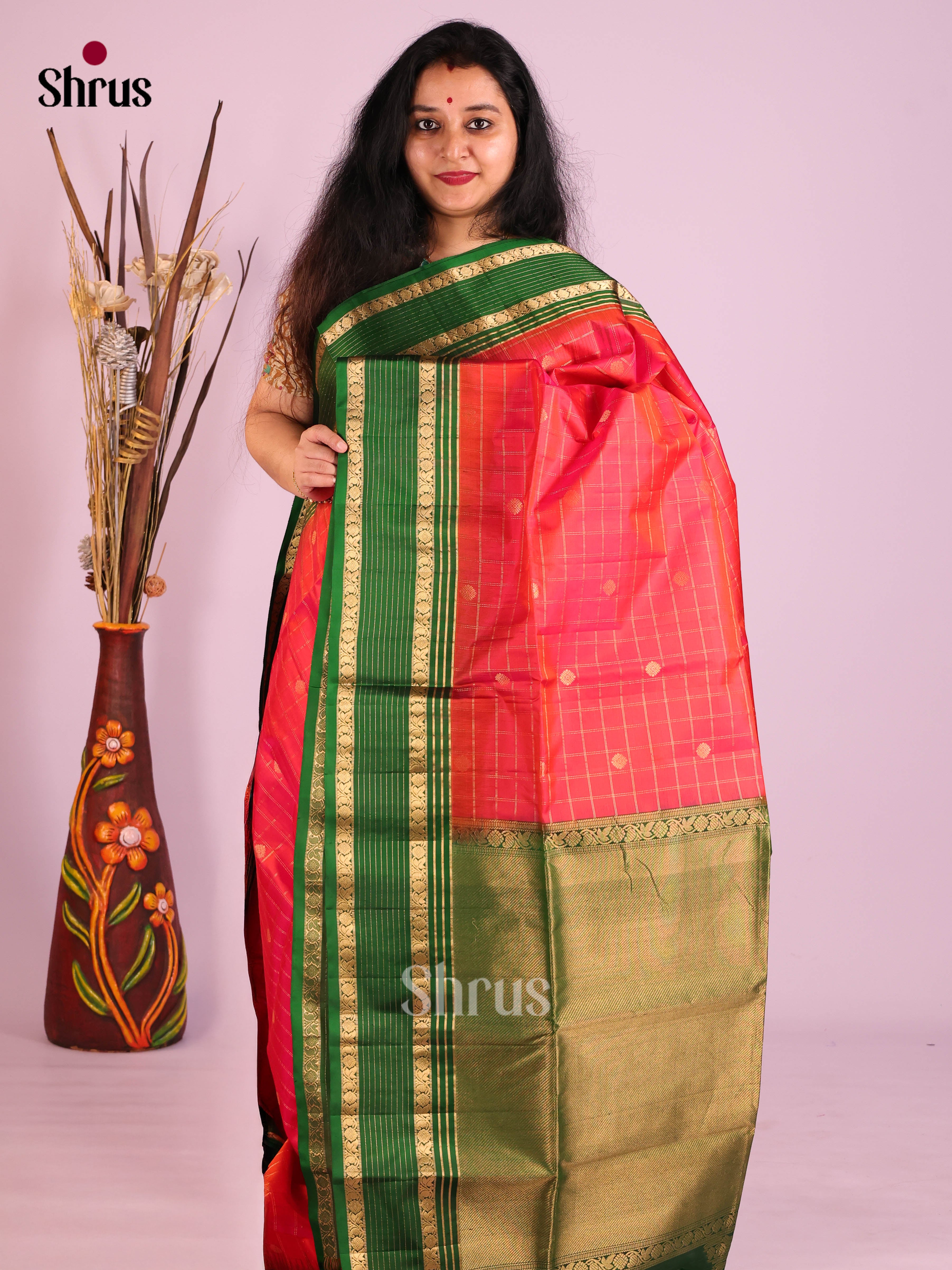 Radiant Orangish pink Soft Silk Saree with zari checks, buttas & Green Rettaipet Border