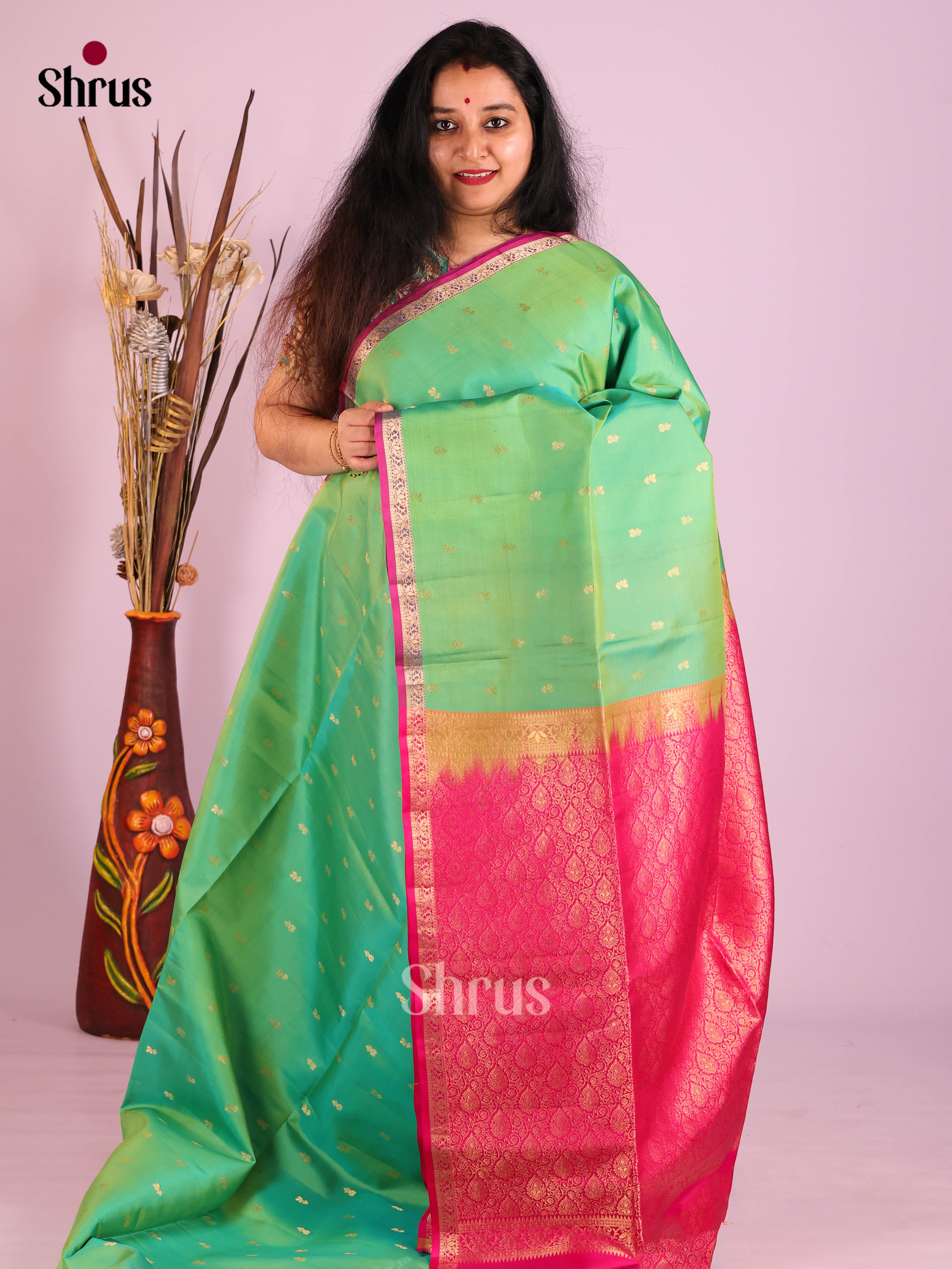 Chic Pista Green Soft Silk Saree with zari buttas & Magenta Brocade Pallu