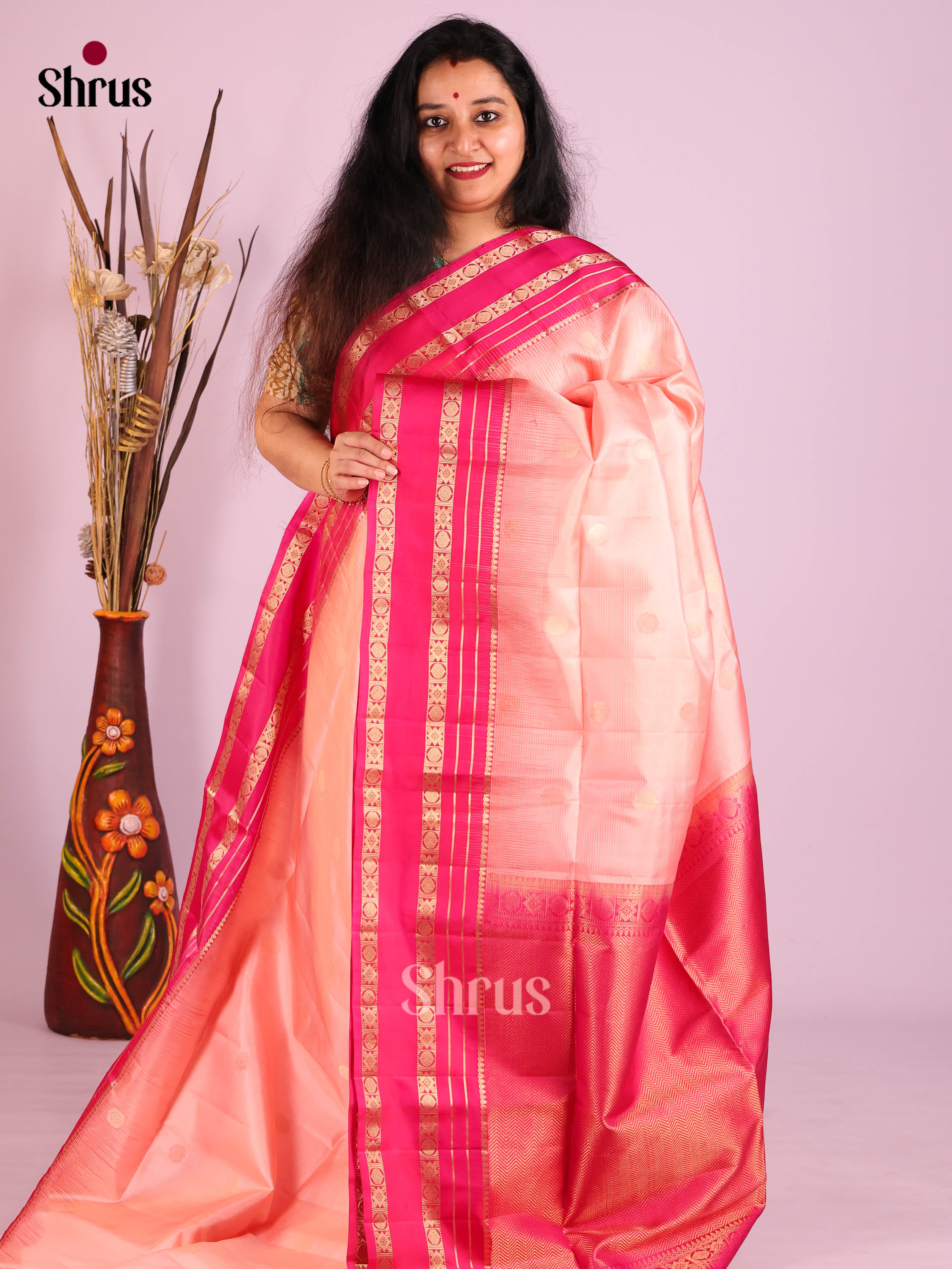Charming Peach Soft Silk Saree with zari checks, floral buttas & Pink rettaipet border