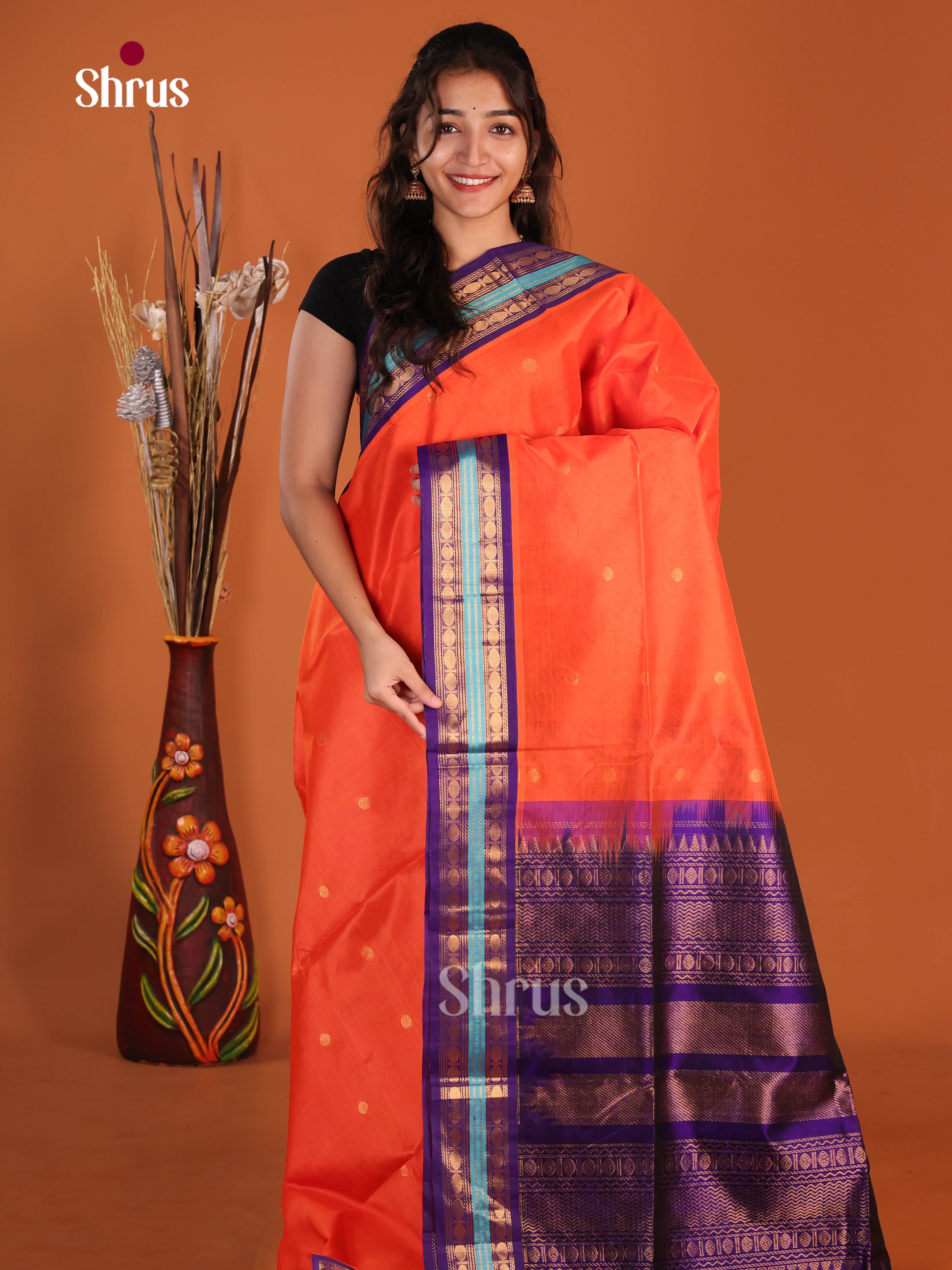 Radiant Orange Silk Cotton Korvai border Saree gleams with zari buttas