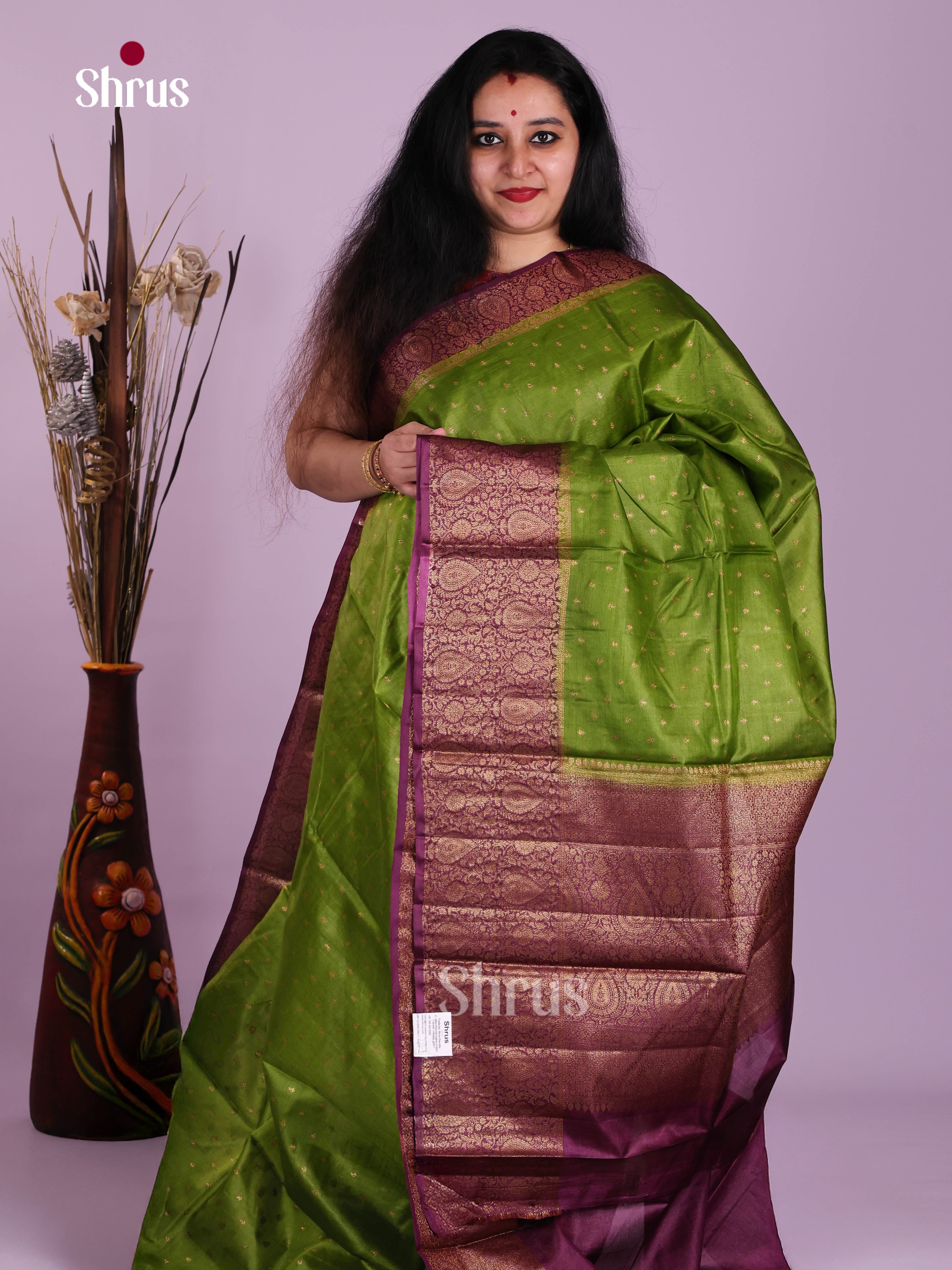 Lustrous Light Green Tussar Saree With Zari Floral Buttas & Purple Border