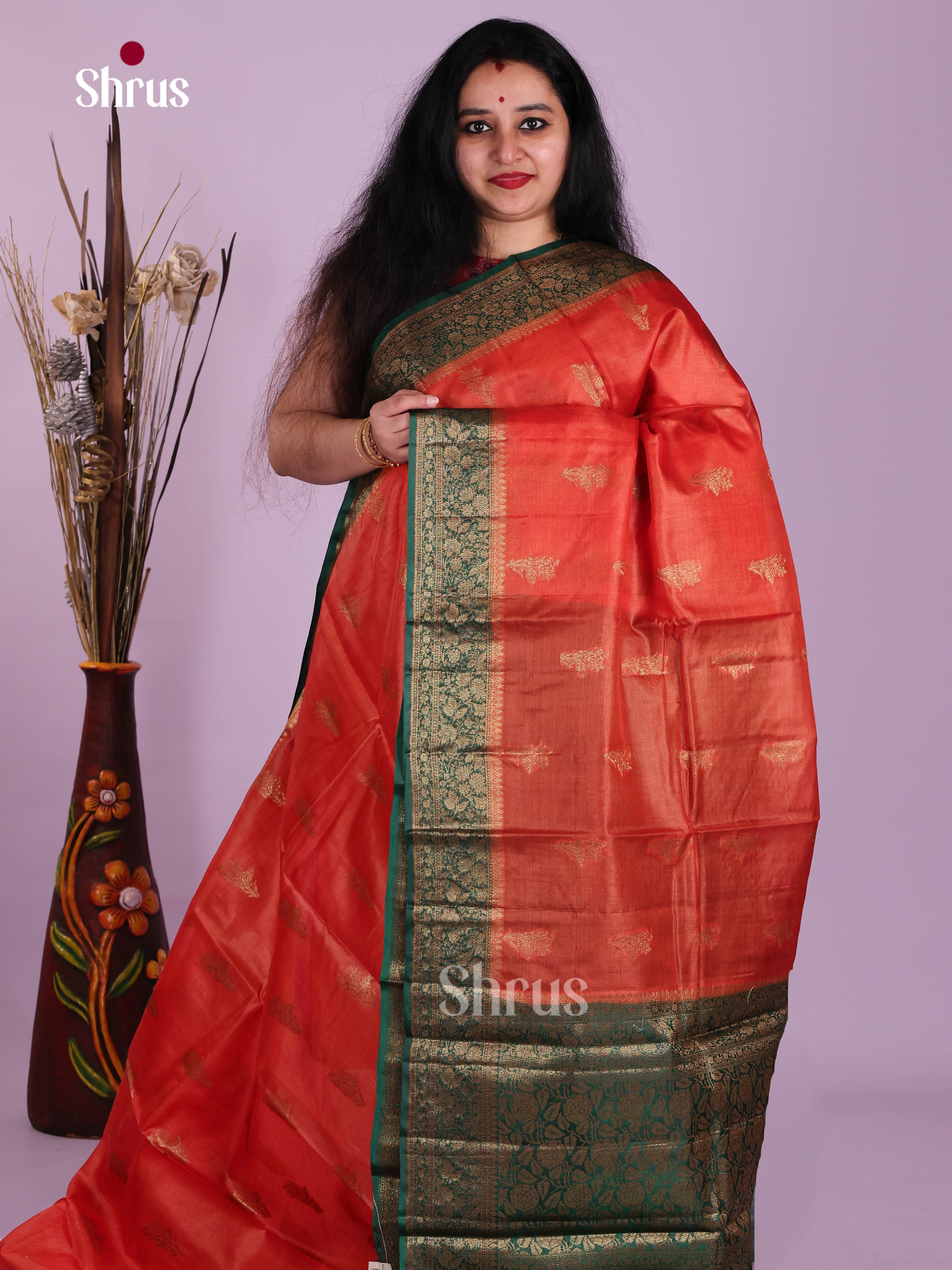 Opulent Orange Handloom Tussar Saree With Floral Motifs & Green Zari Pallu