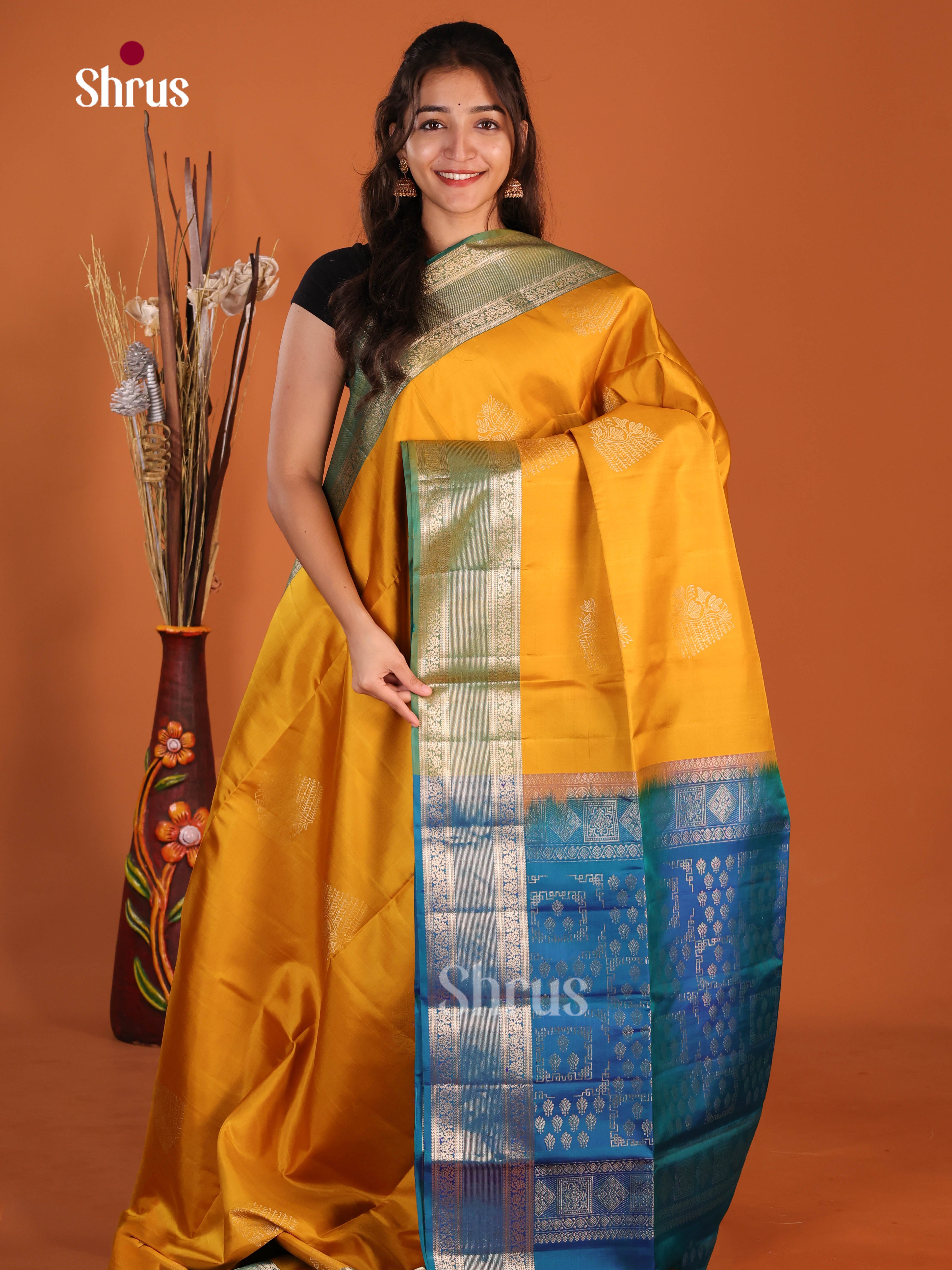 Glorious Mambazha Yellow & Blue Soft Silk Saree gleams with zari floral motifs - Shop on Shrus.com