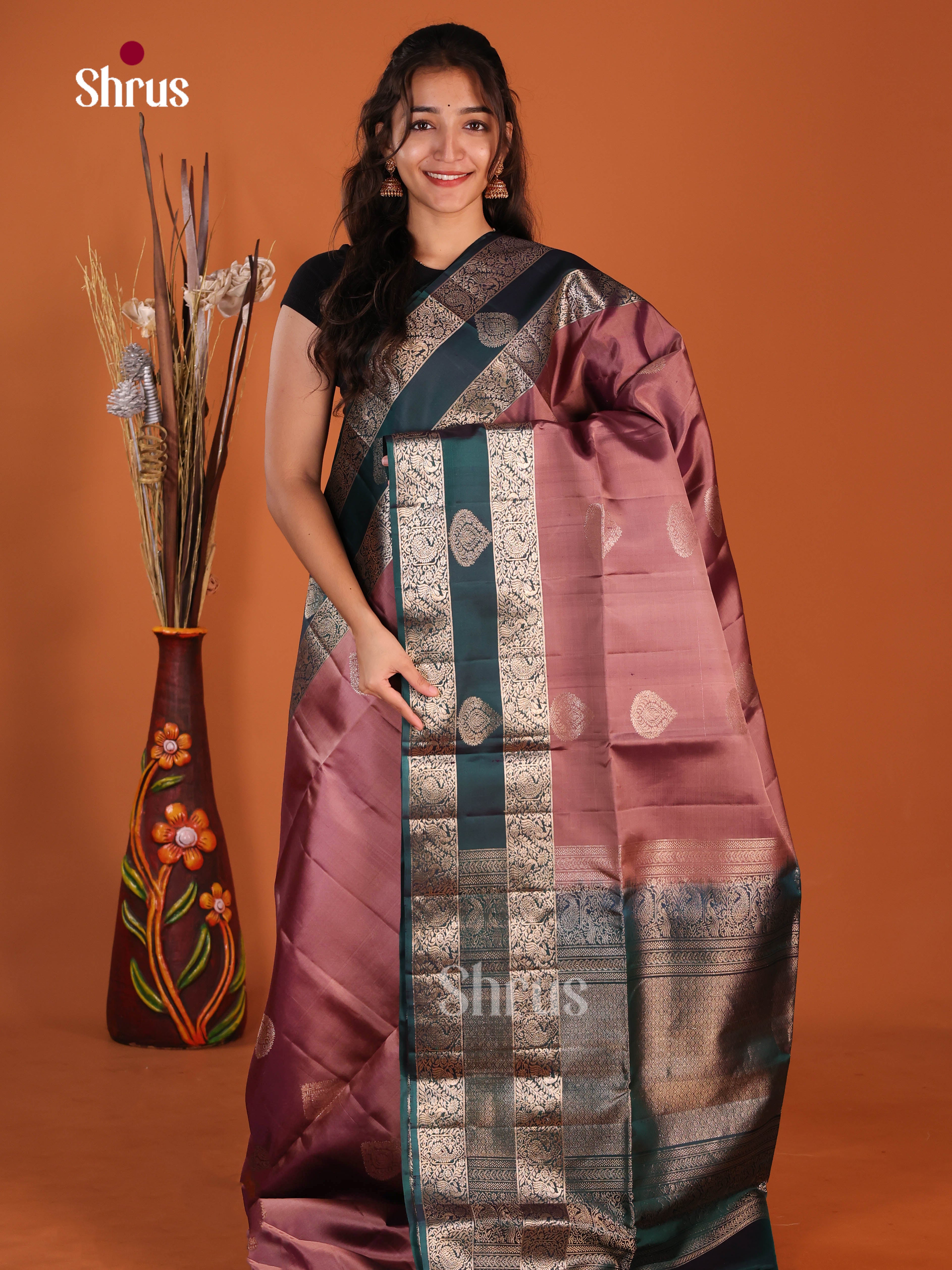 Lustrous Onion Peel & Green Soft Silk Saree gleams with zari floral drop motifs, rettaipet zari border