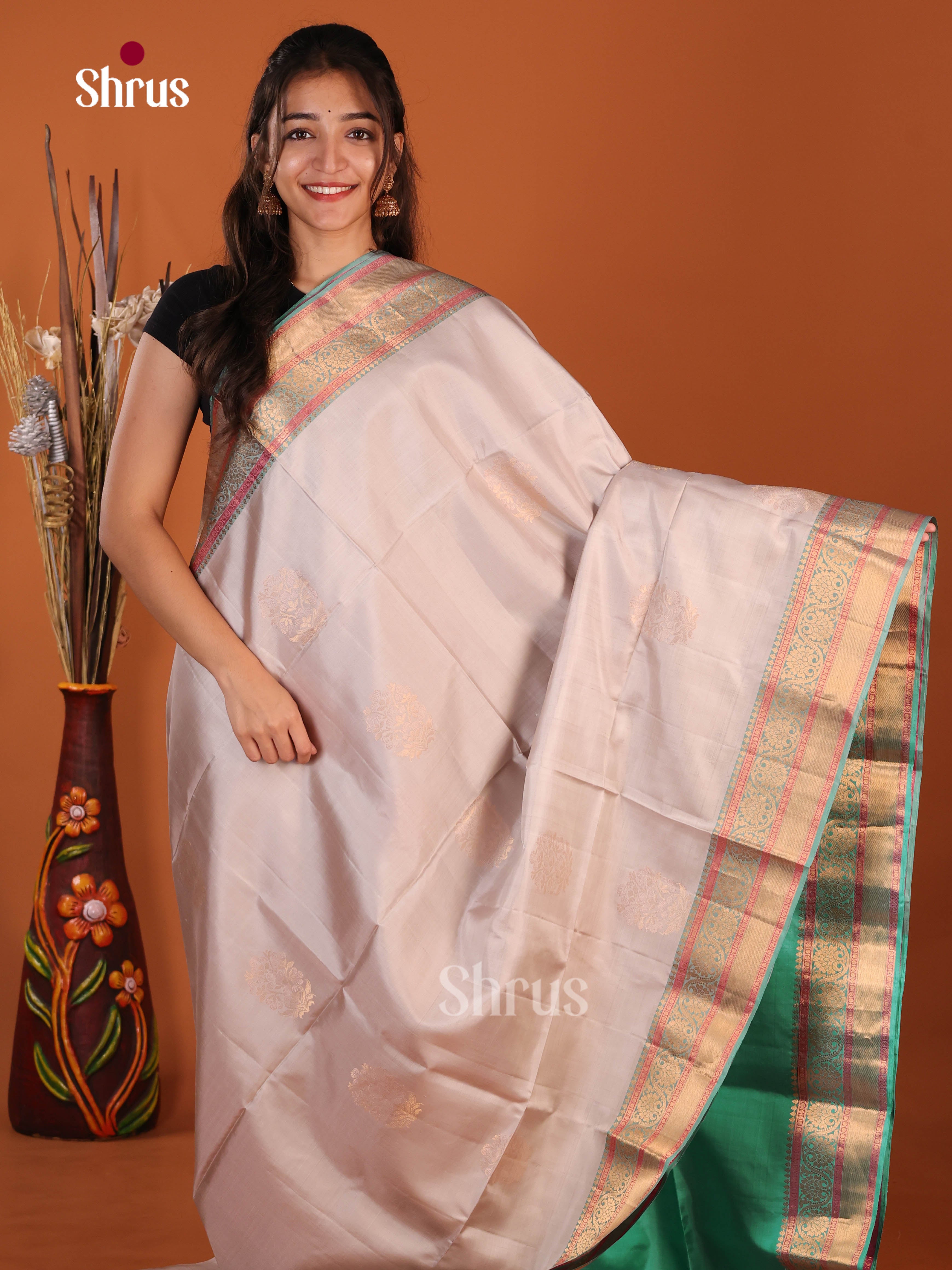 Lavish Grey & Green Soft Silk Saree with zari floral  motifs , traditional zari border