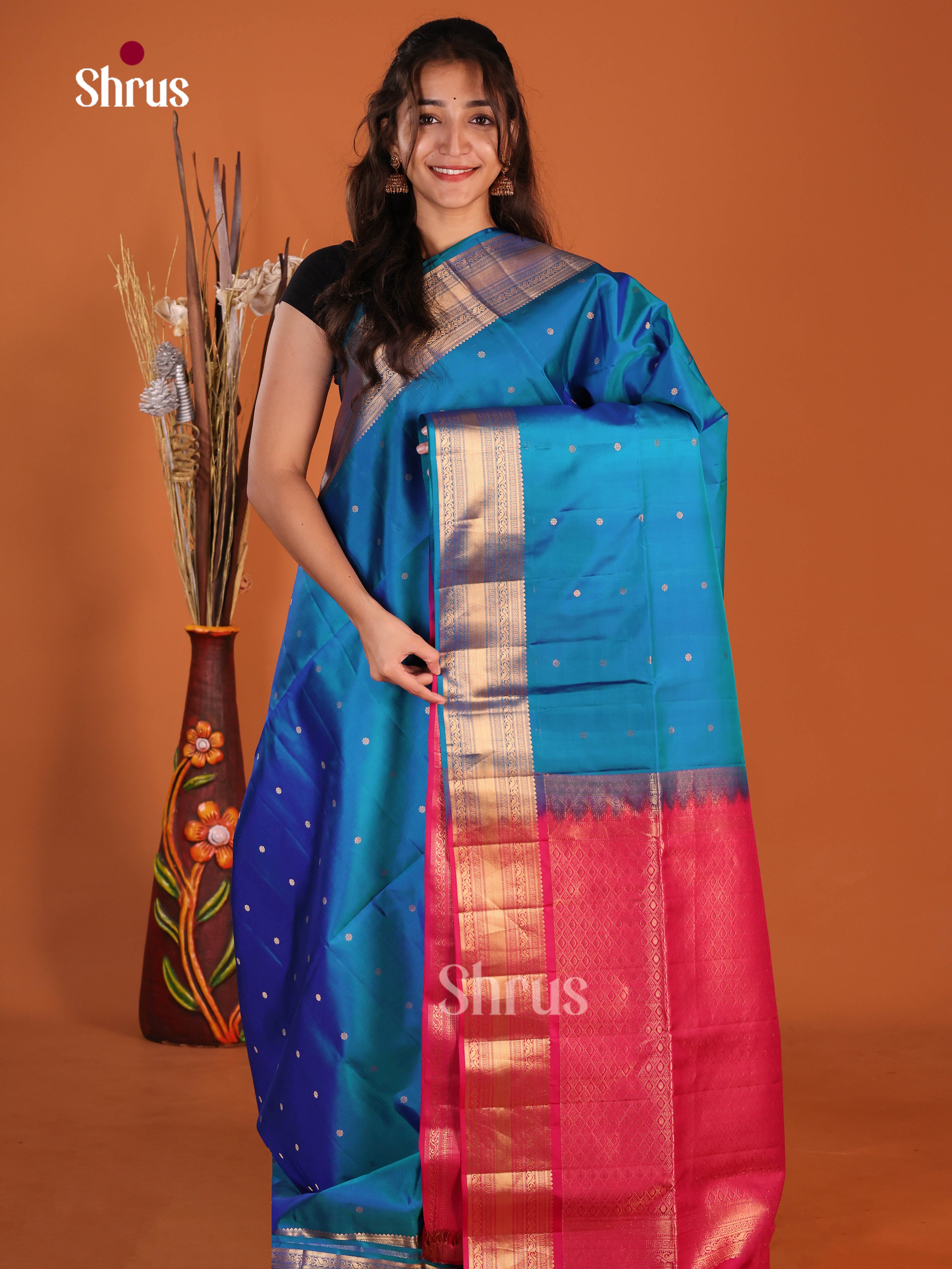 Regal Blue Soft Silk Saree gleams with zari floral buttas , brocade pallu