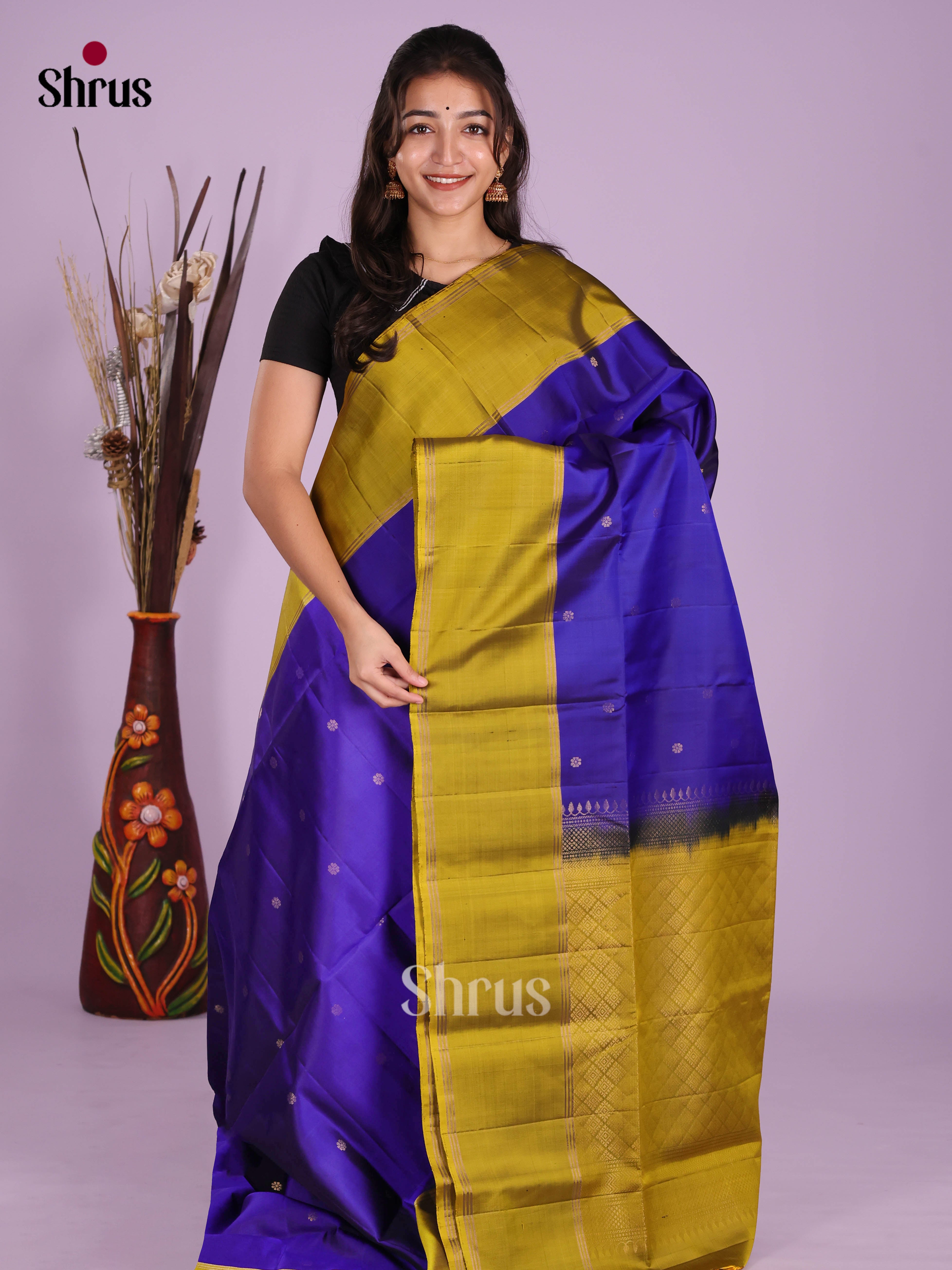 Radiant Blue & Mehandi Green Soft Silk Saree dazzles with gold zari buttas