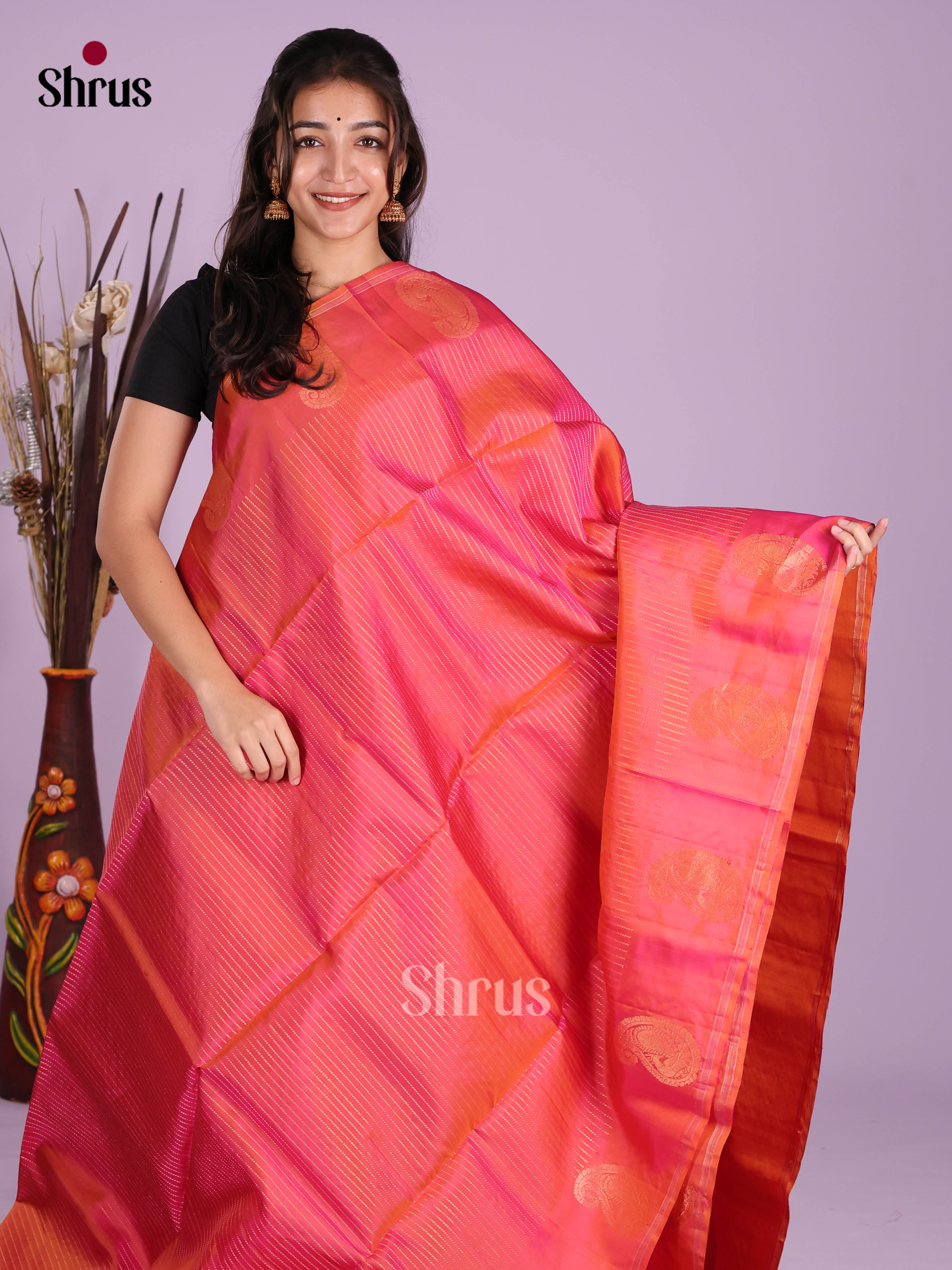 Dazzling Orangish Pink Soft Silk Saree with Zari Stripes & Paisleys Motifs Printed Border