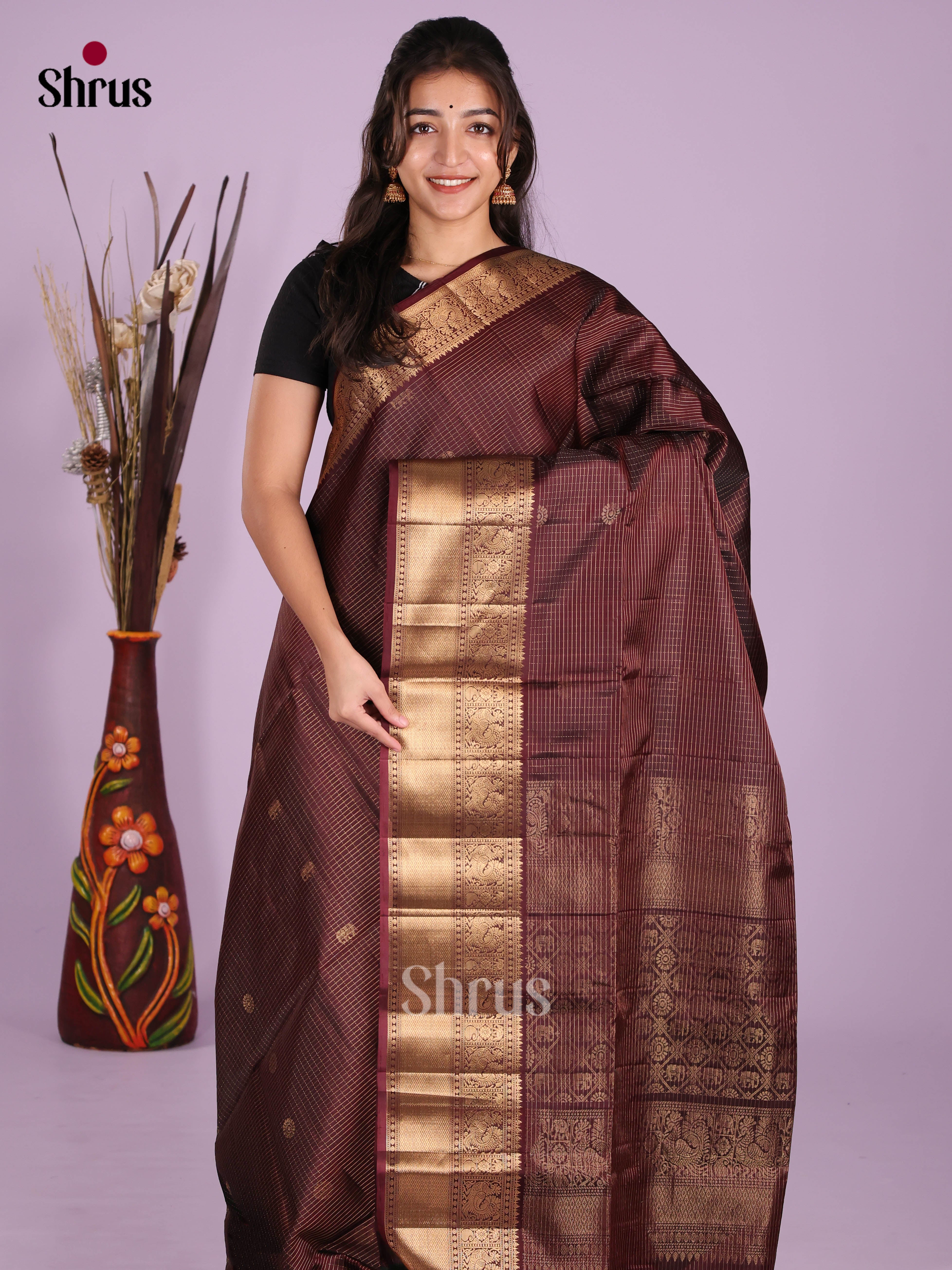 Timeless Maroon Soft Silk Saree gleams with zari checks & elephant buttas
