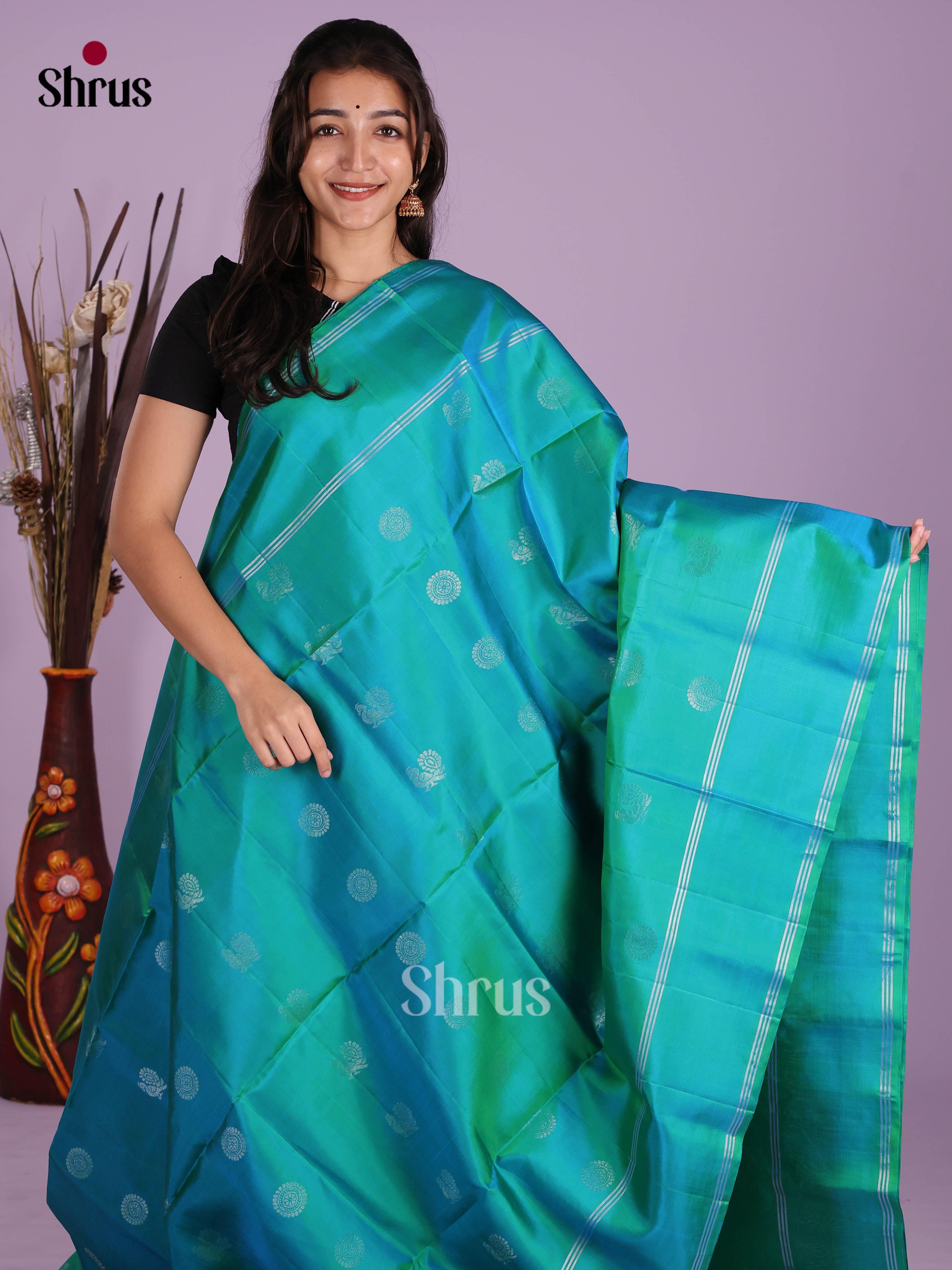 Radiant Green Soft Silk Saree with zari buttas & splendid brocade pallu