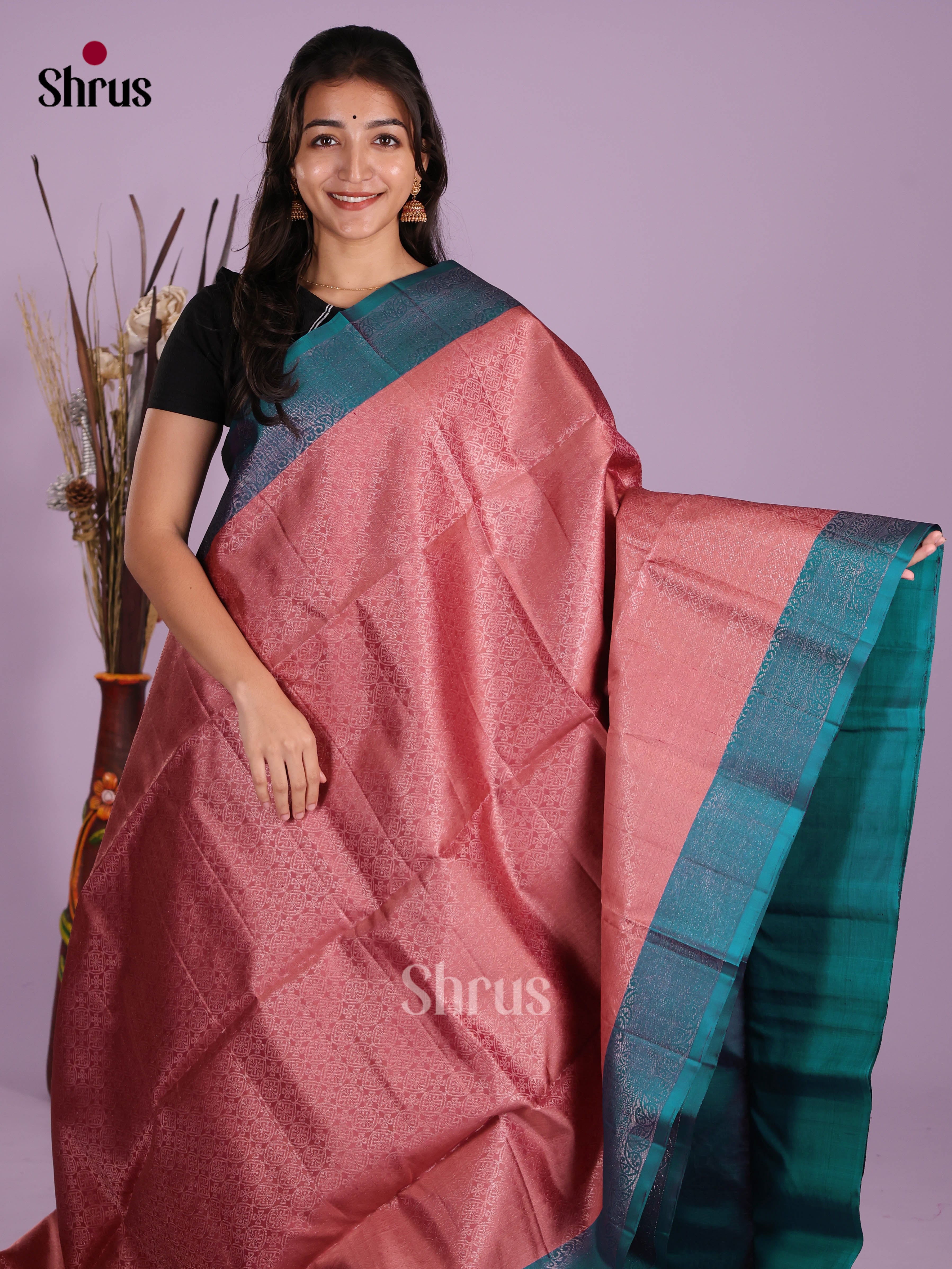 Charming Pink & Peacock Green Soft Silk Saree with zari woven floral nestling brocade
