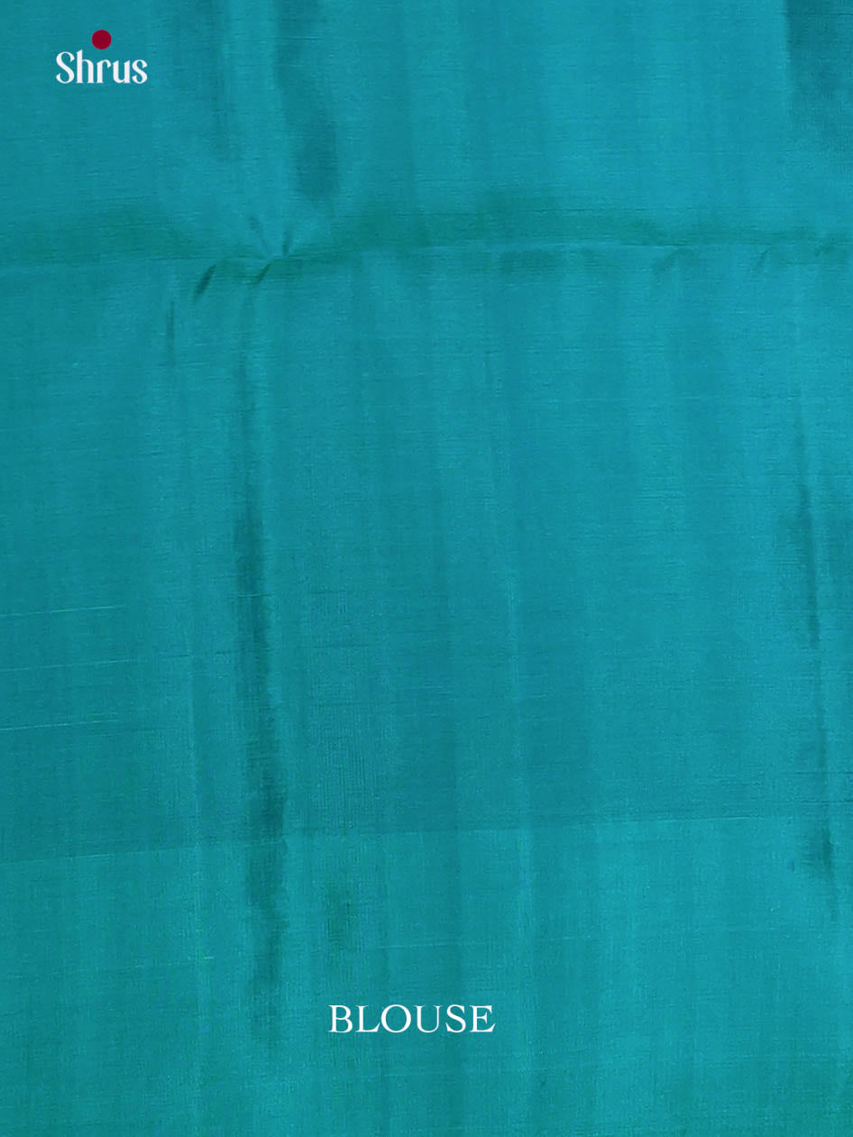 Elegant Pista Green & Green Soft Silk Saree dazzles with zari floral nestling brocade