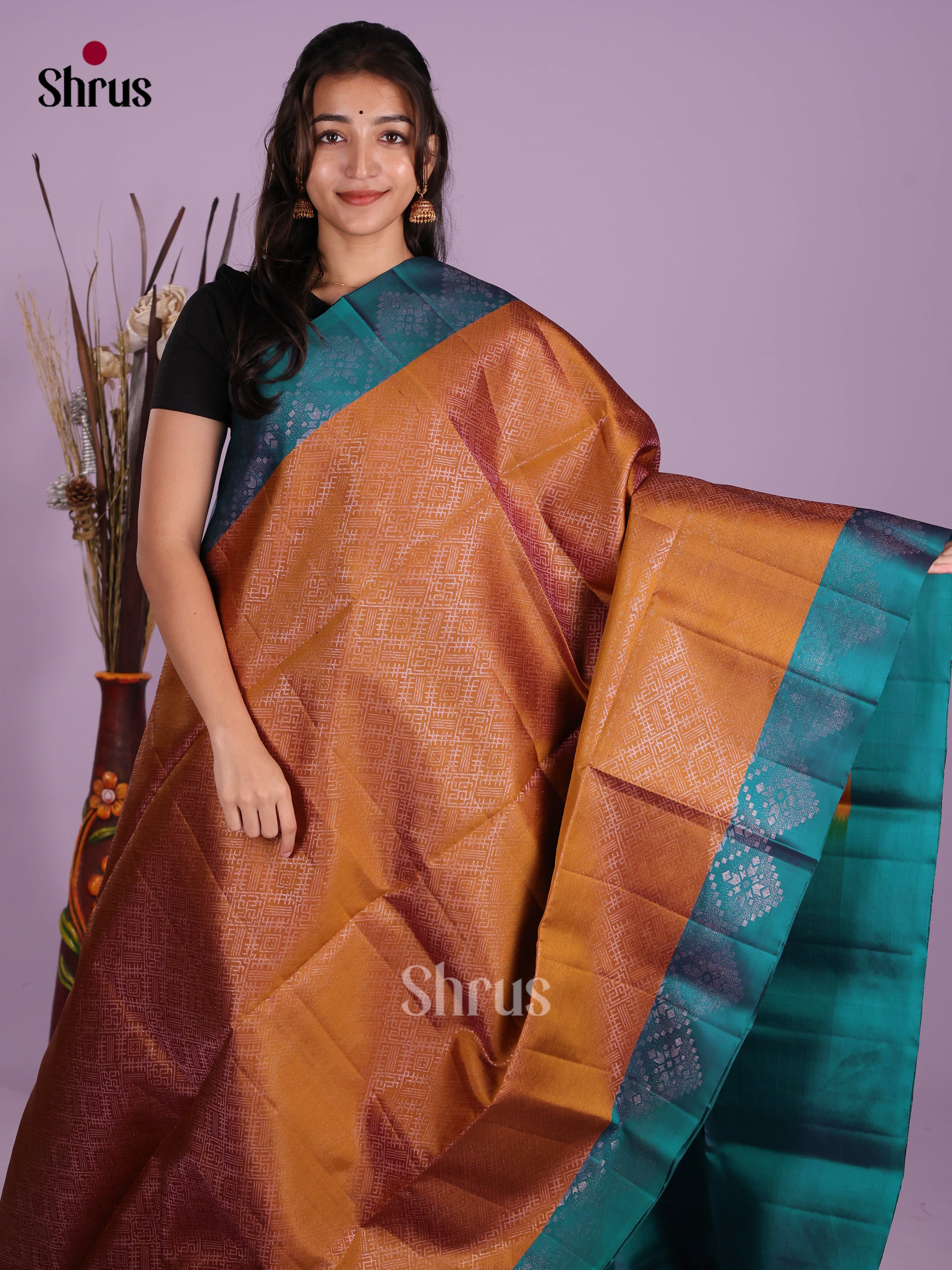 Radiant Rust  Soft Silk Saree with zari woven floral nestling brocade