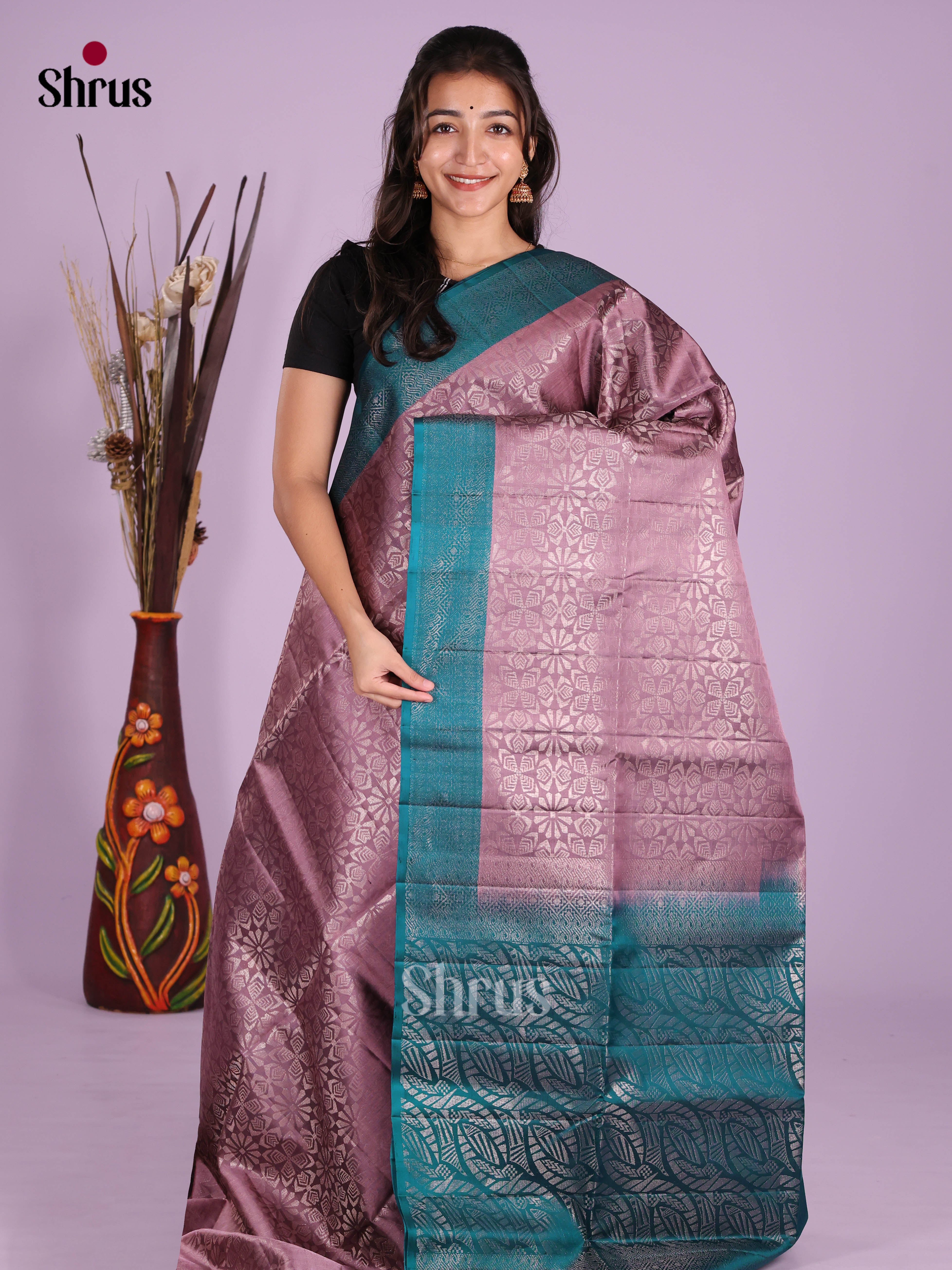 Regal Mauve & Blue Soft Silk  Saree gleams with zari floral brocade