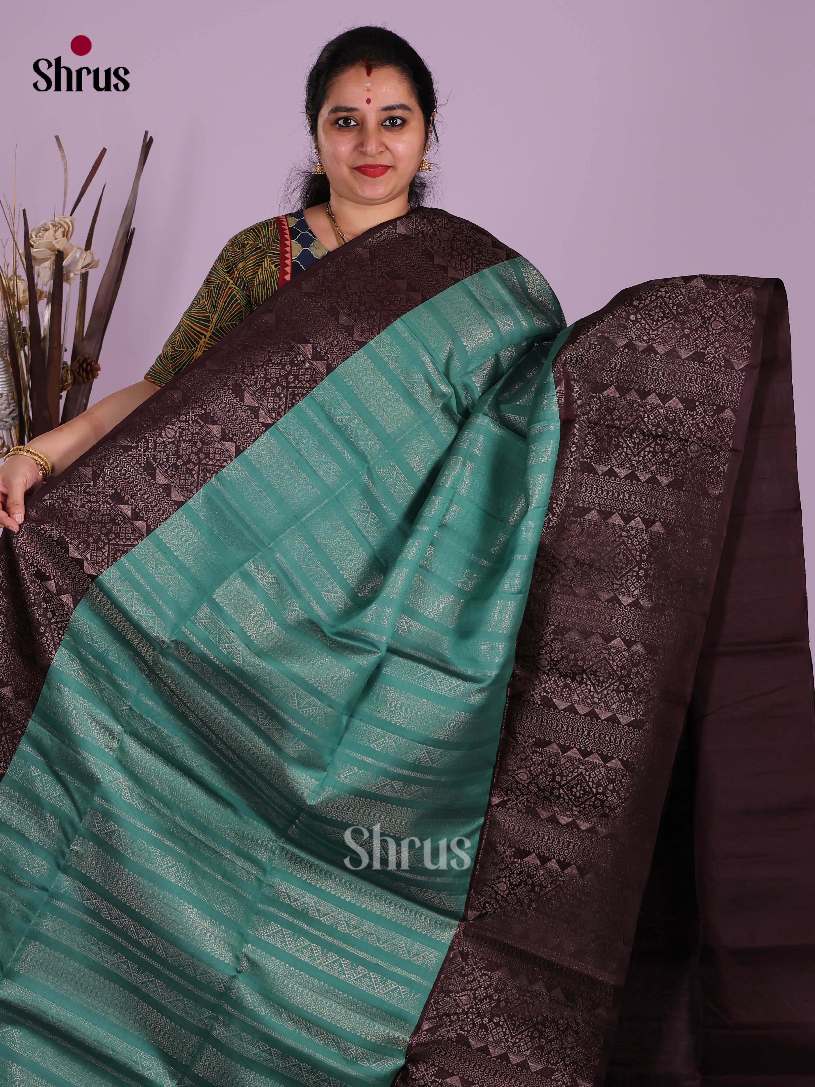 Sheeny Teal green Soft Silk Saree With Zari Stripes & Brown Brocade Border