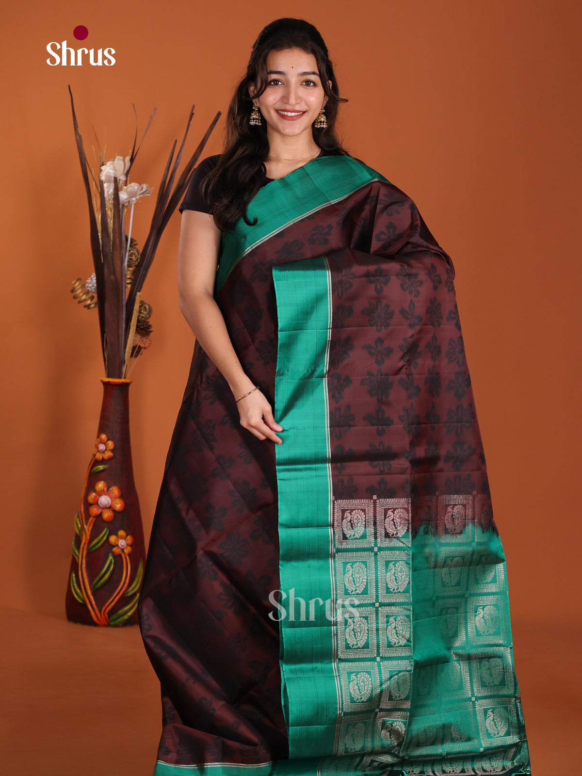 Stunning Brown & Green Soft Silk Saree with floral buttas & peacock motif pallu - Shop on Shrus.com