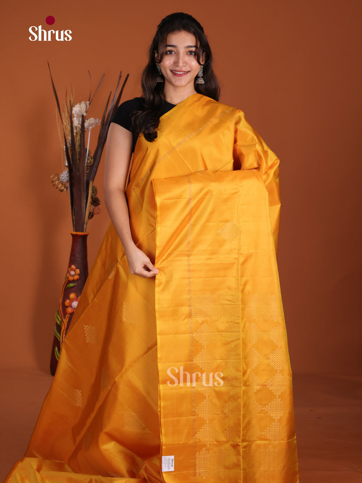 Lustrous Mustard single tone Soft Silk  Saree with zari kolam motifs