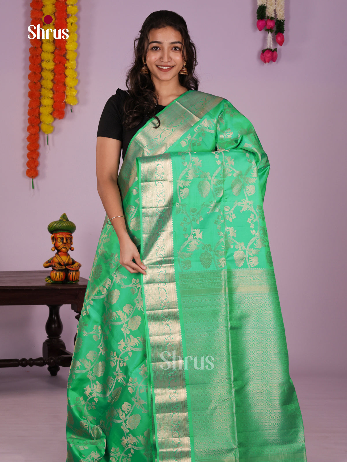 Radiating Pastel Green Soft Silk Saree with zari floral nesting brocade