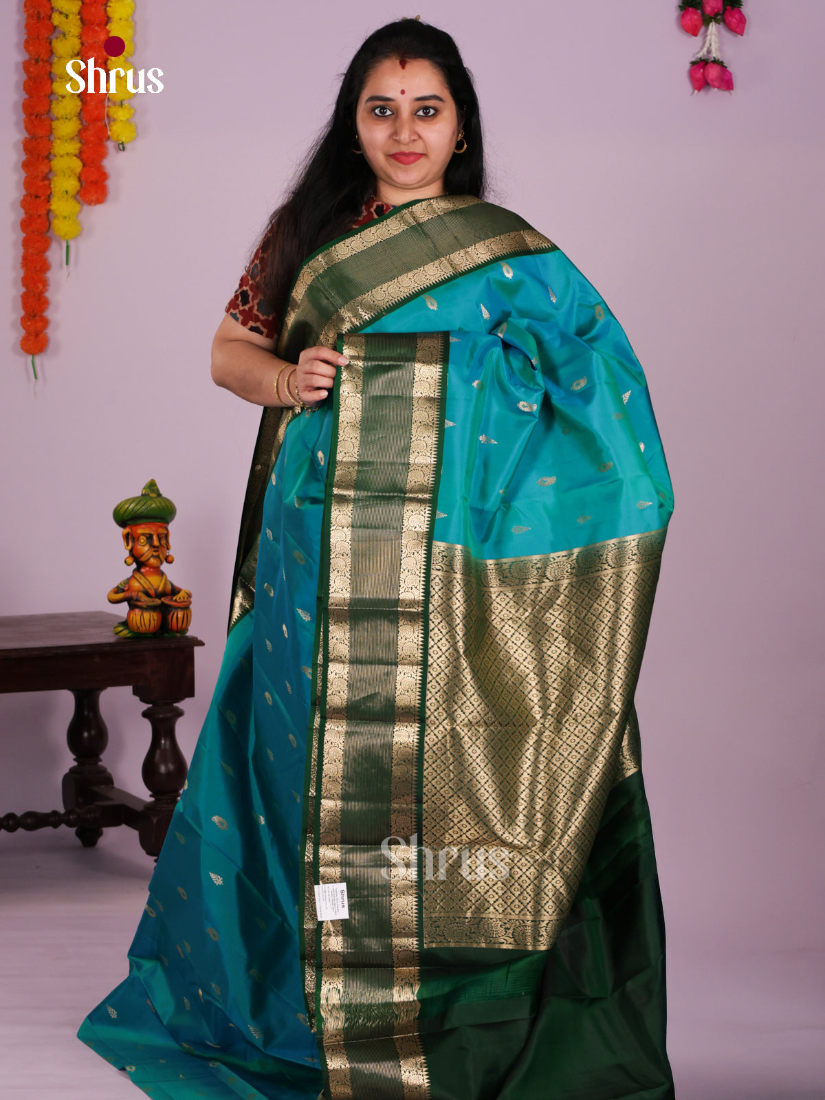 Turquoise Kanchipuram Saree With Green Rettaipet Zari Border