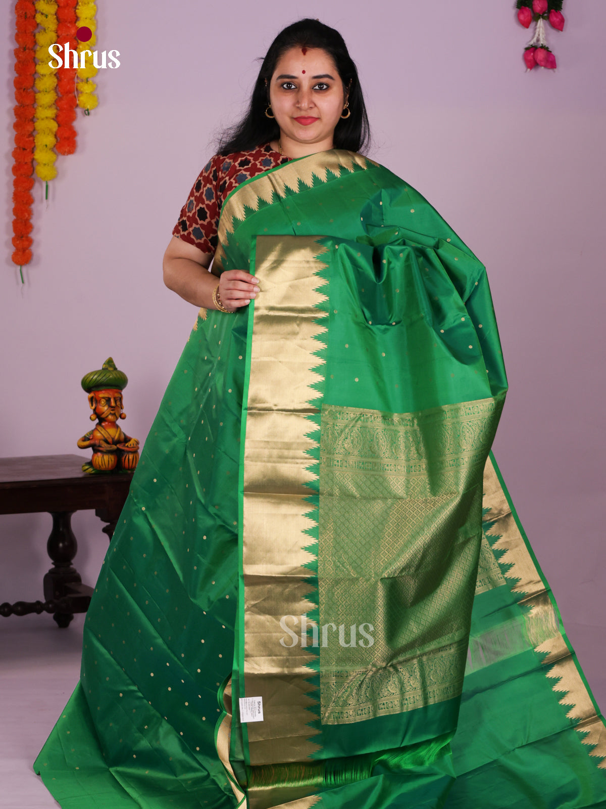 Serene Green Kanchipuram Saree With Small Buttas & Zari Woven Temple Border