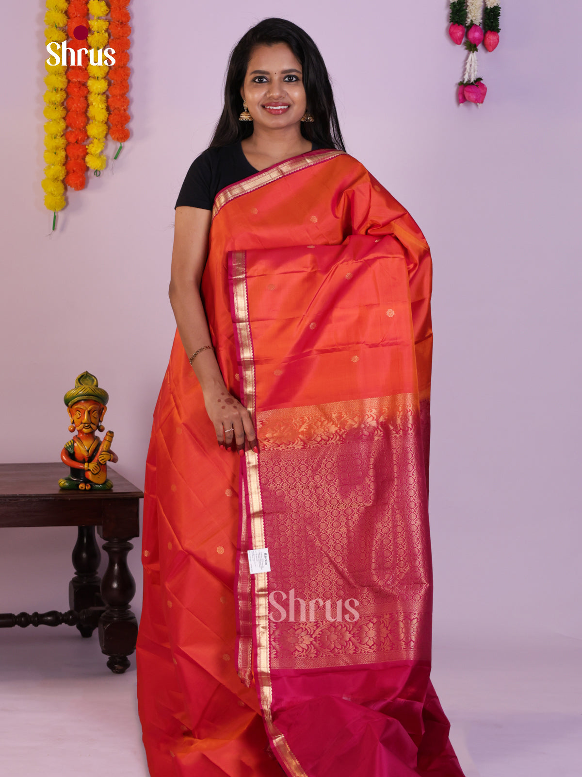 Radiant Orange Kanjivaram Silk Saree With floral Buttas & Pink Small Border