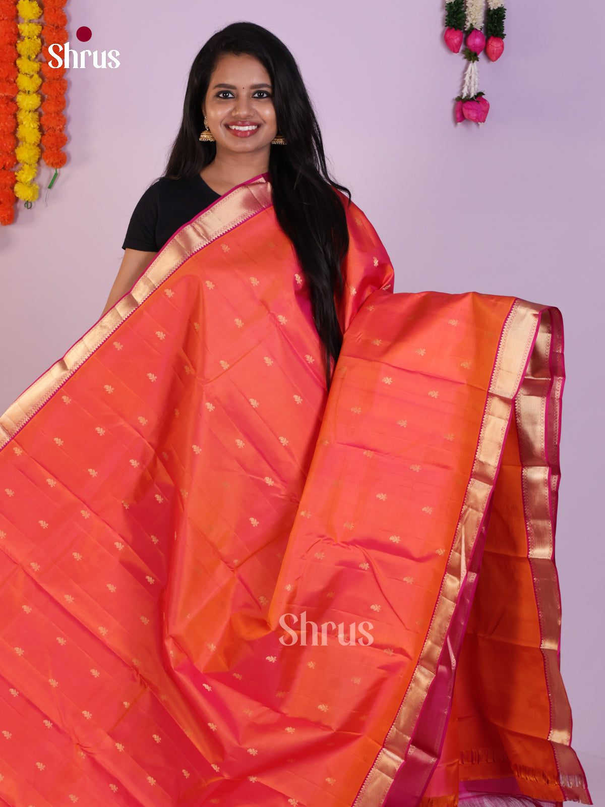 Radiant Orange Kanjivaram Saree with Zari Buttas & Purple Brocade Pallu