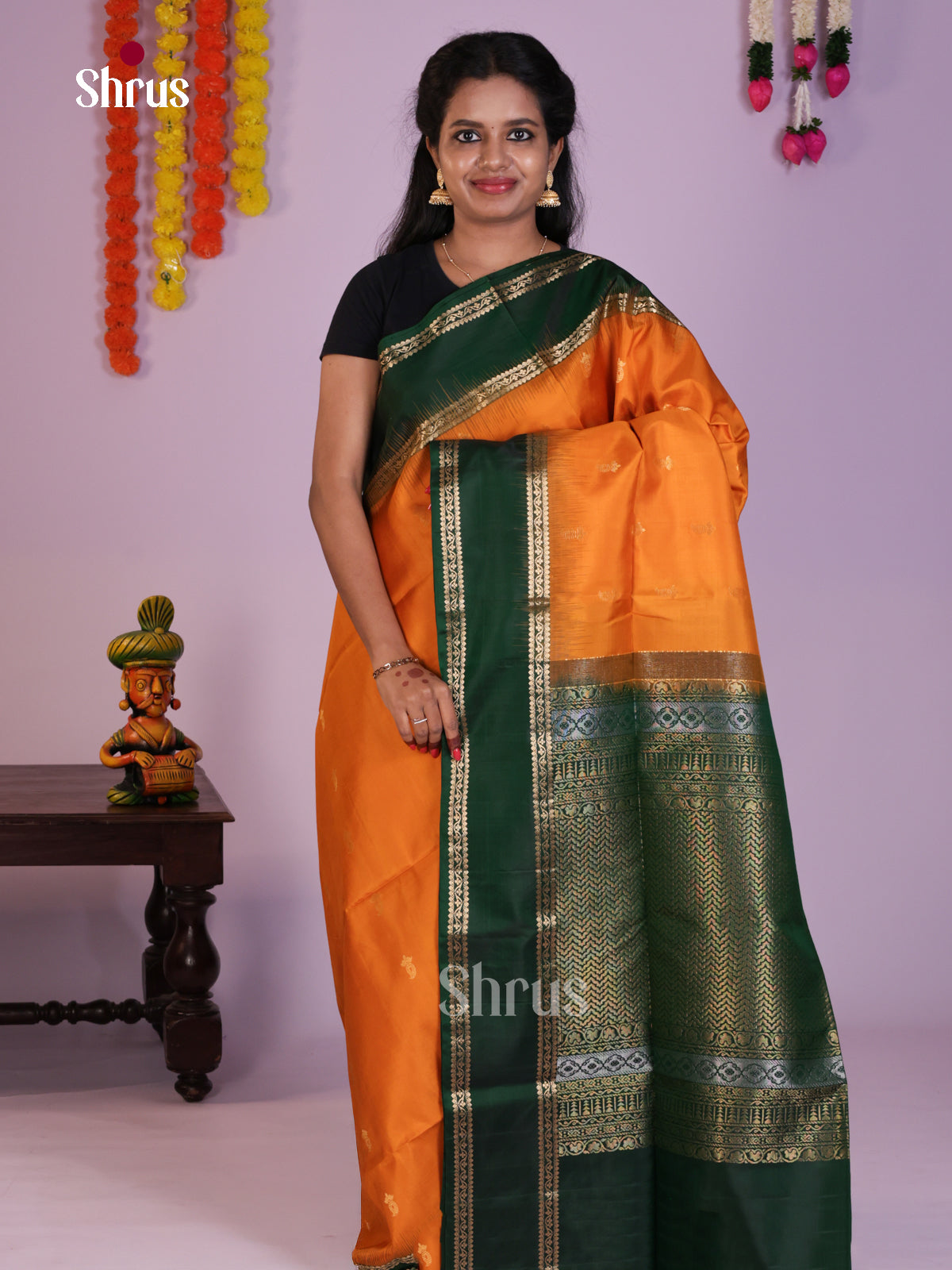 Radiant Orange & Green Soft Silk Saree with zari buttas & Rettaipet border