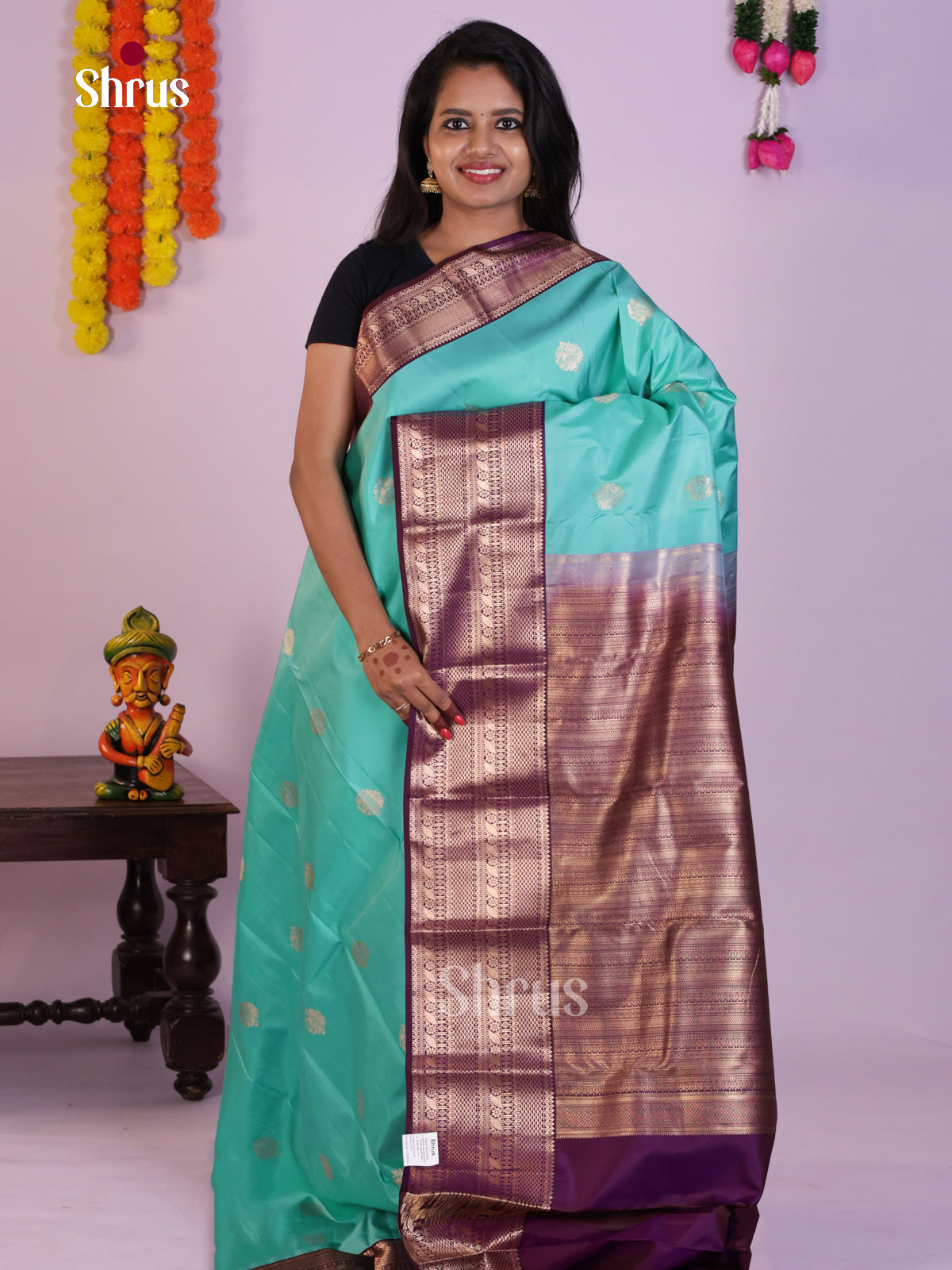 Graceful Aqua Blue Kanjivaram Silk Saree With Floral Motifs & Purple Pallu