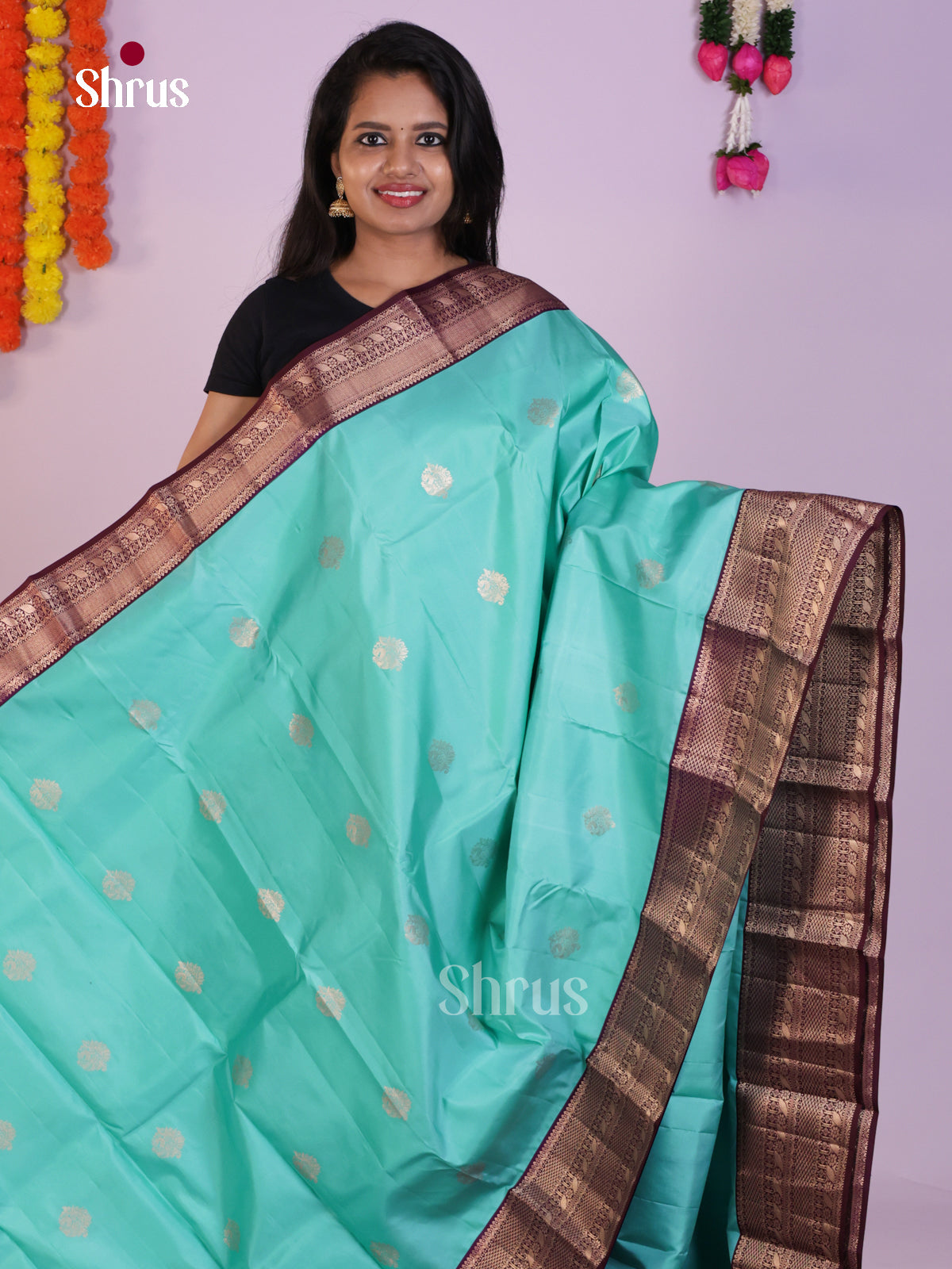 Graceful Aqua Blue Kanjivaram Saree With Floral Motifs & Purple Pallu