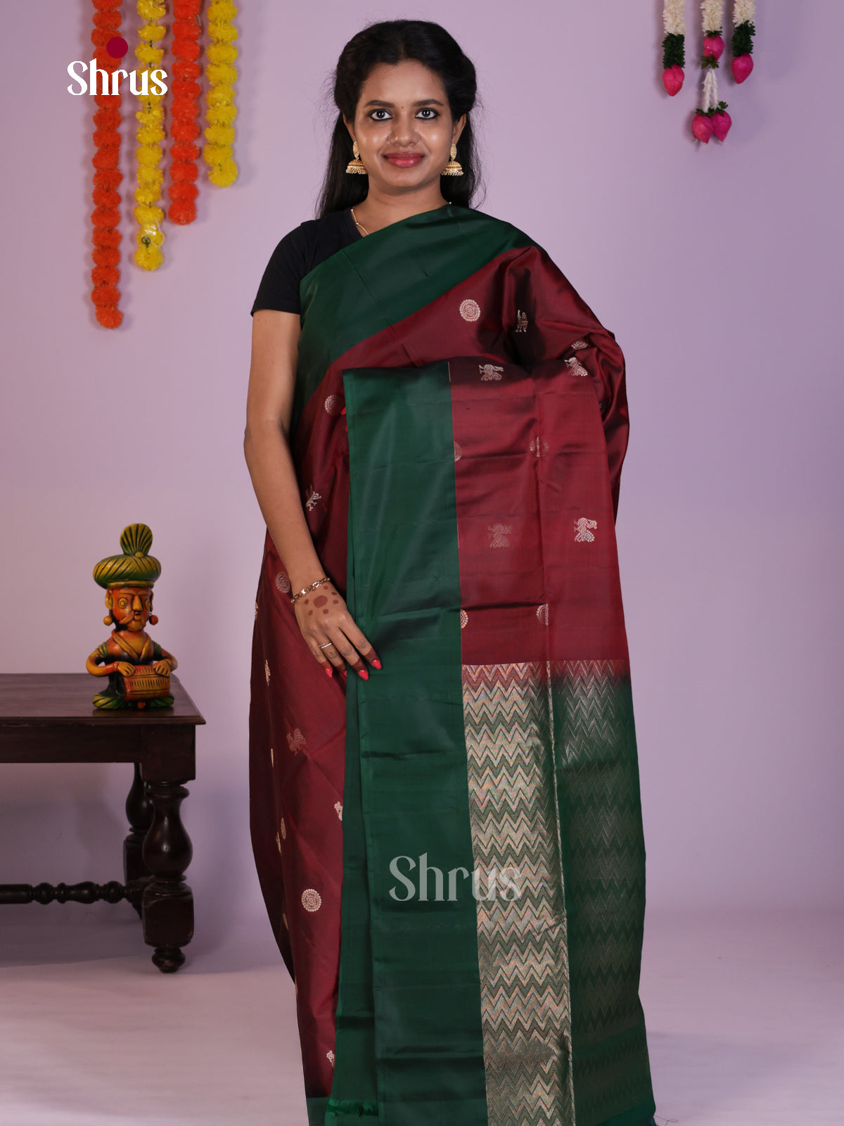 Beautiful Maroon & Green Soft Silk Saree gleams with zari peacock buttas