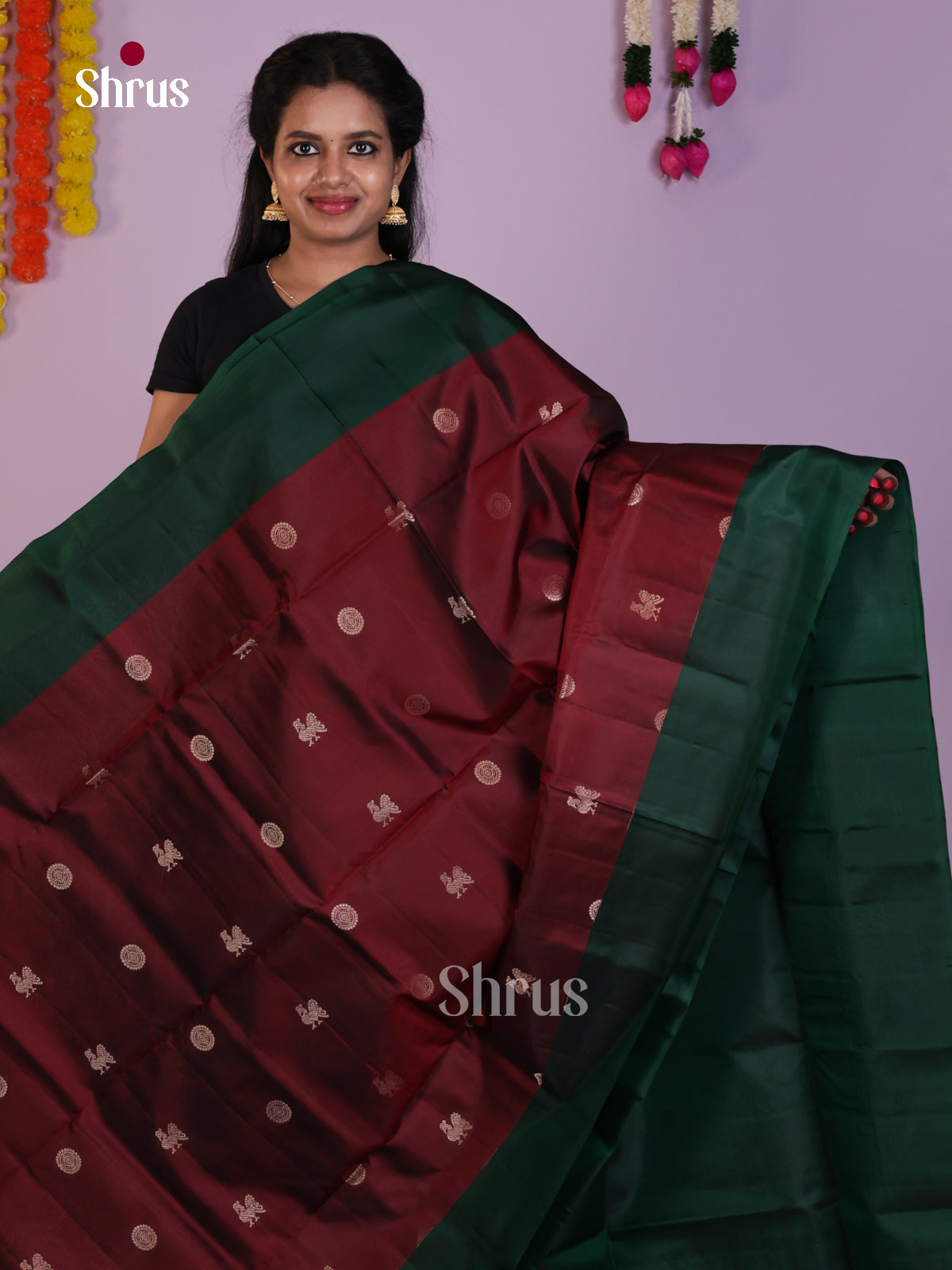 Beautiful Maroon & Green Soft Silk Saree gleams with zari peacock buttas