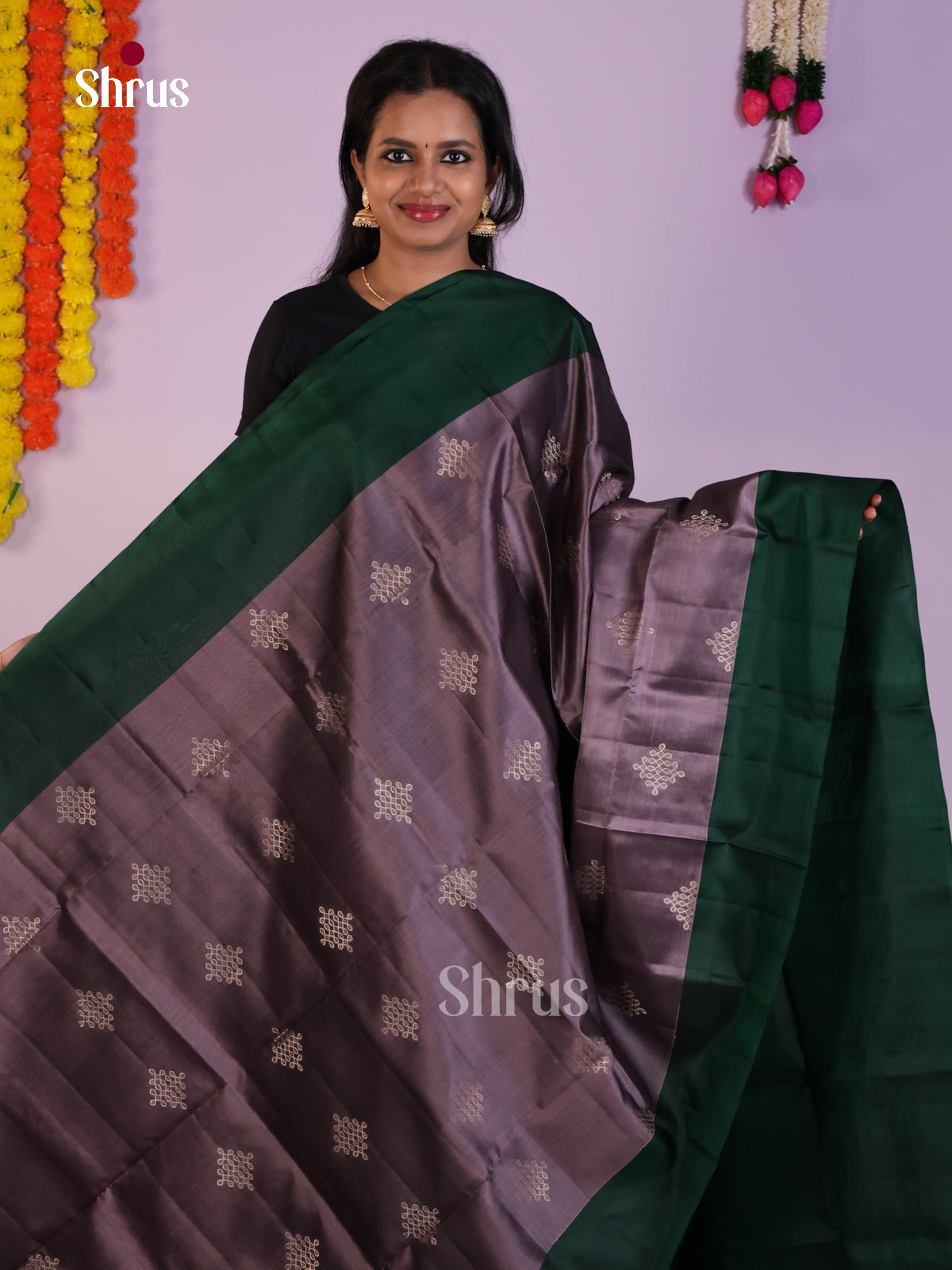 Vivacious Lilac & Green Soft Silk  Saree gleams with zari kolam motifs