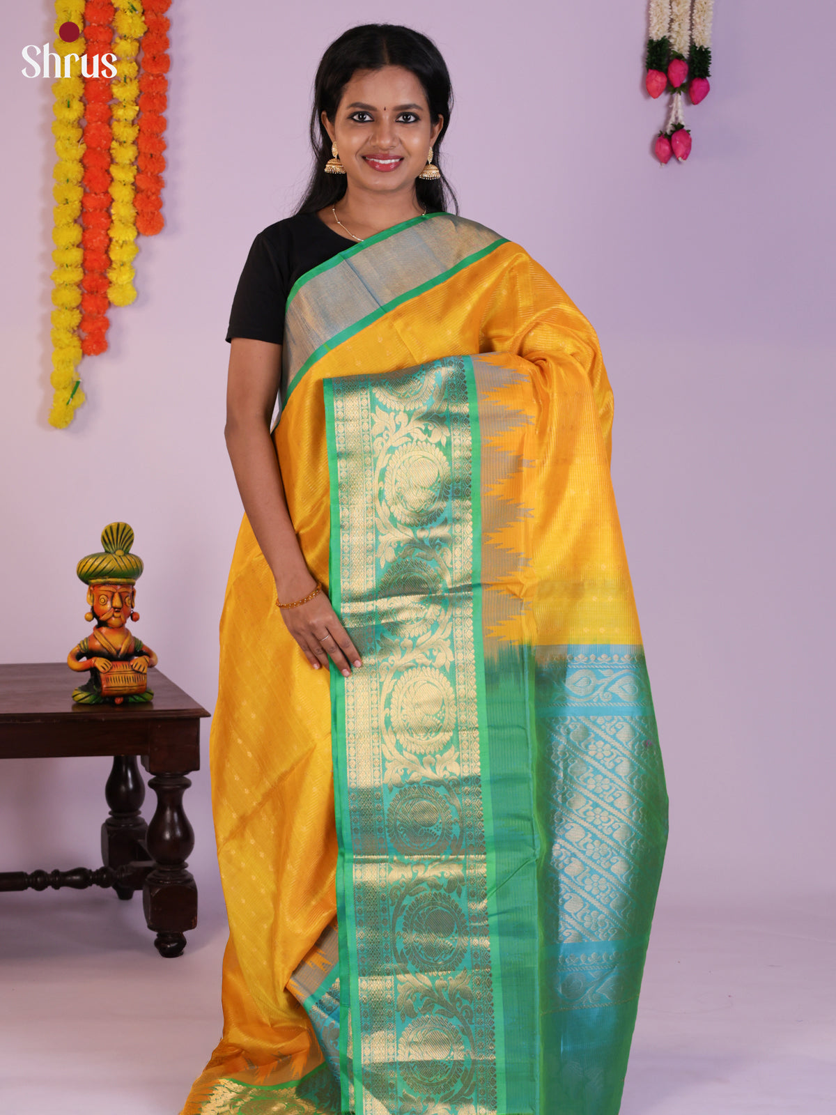 Glorious Yellow & Teal Green Silk Cotton Saree with zari checks, buttas & zari border -DLS29012