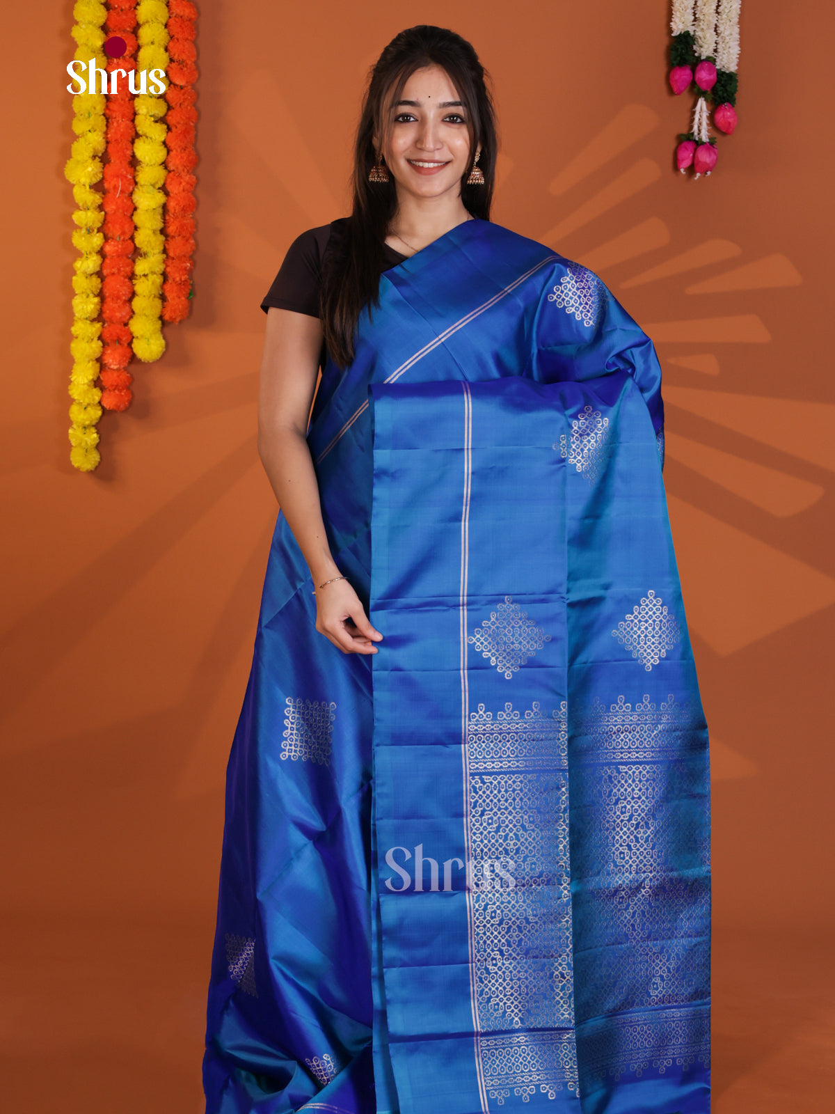 Vibrant Blue Soft Silk Saree with zari kolam motifs - Shop on Shrus.com