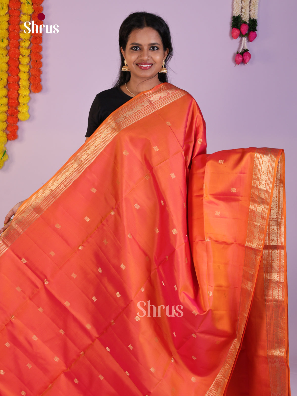 Radiant Orange Soft Silk Saree with zari peacock buttas & brocade pallu