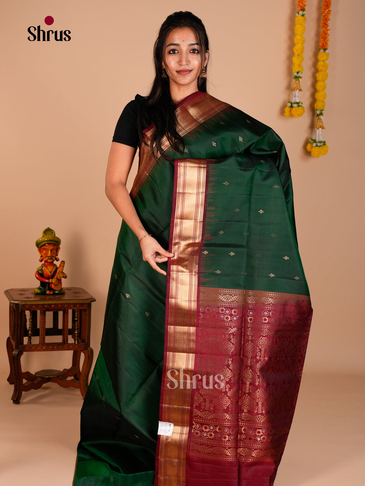 Buy Enchanting Dark Green Soft Silk Saree with Floral Buttas & Maroon Traditional Zari Border